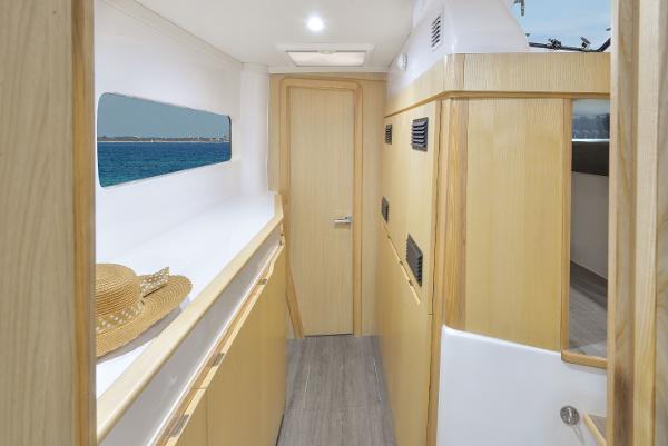 Interior of 2025 Seawind 1170 catamaran with wooden finishes and ocean view.