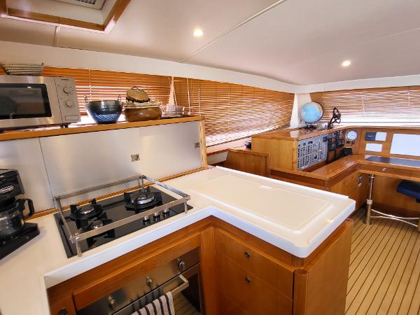 Interior of 2009 Catana 65 yacht with modern kitchen and navigation area.