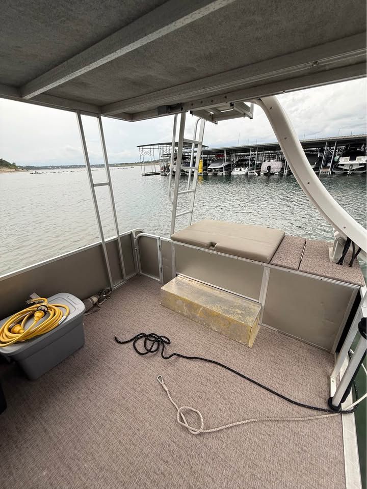 Interior of a 2008 Sun Tracker Party Cruiser on the water.