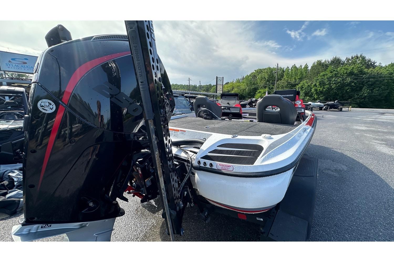 2023 Nitro Z20 Pro boat with powerful outboard motor in a parking lot.