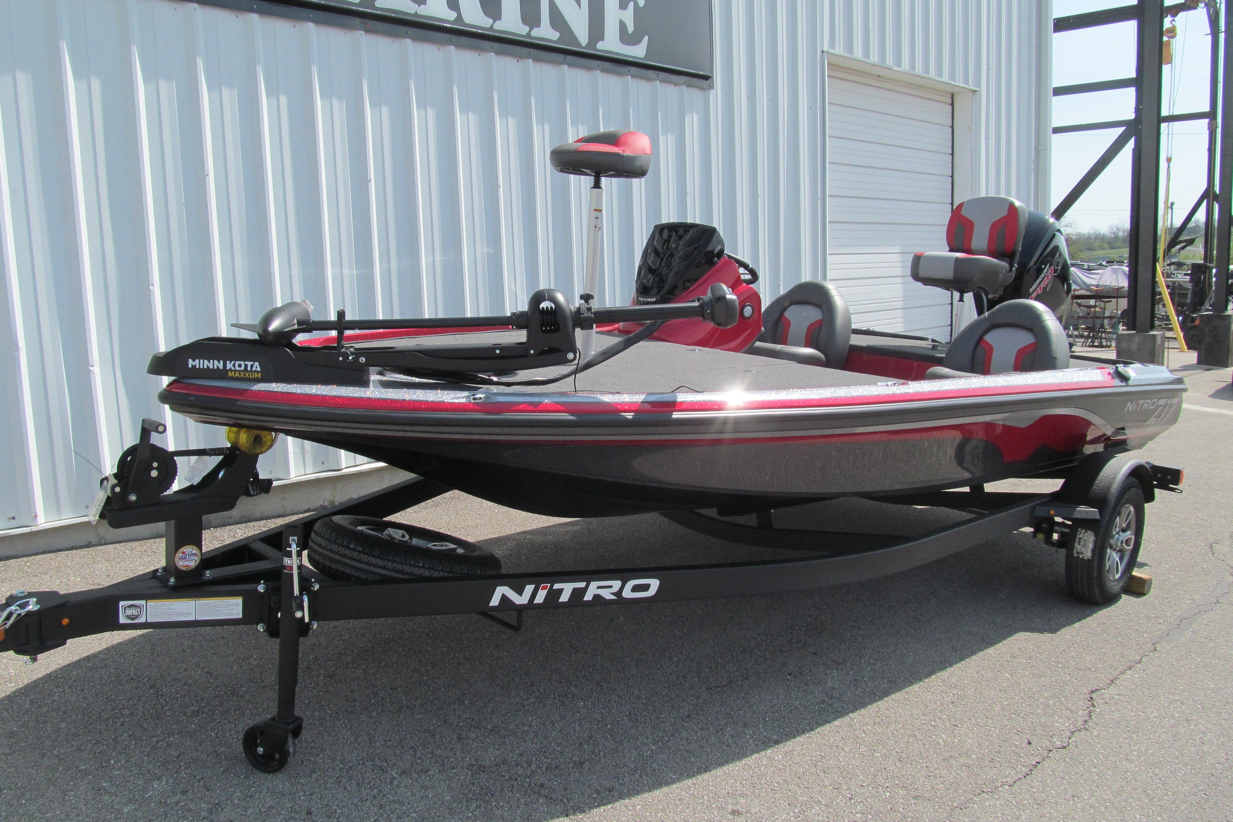2026 Nitro Z17 fishing boat with Minn Kota trolling motor, parked outside a marine facility.