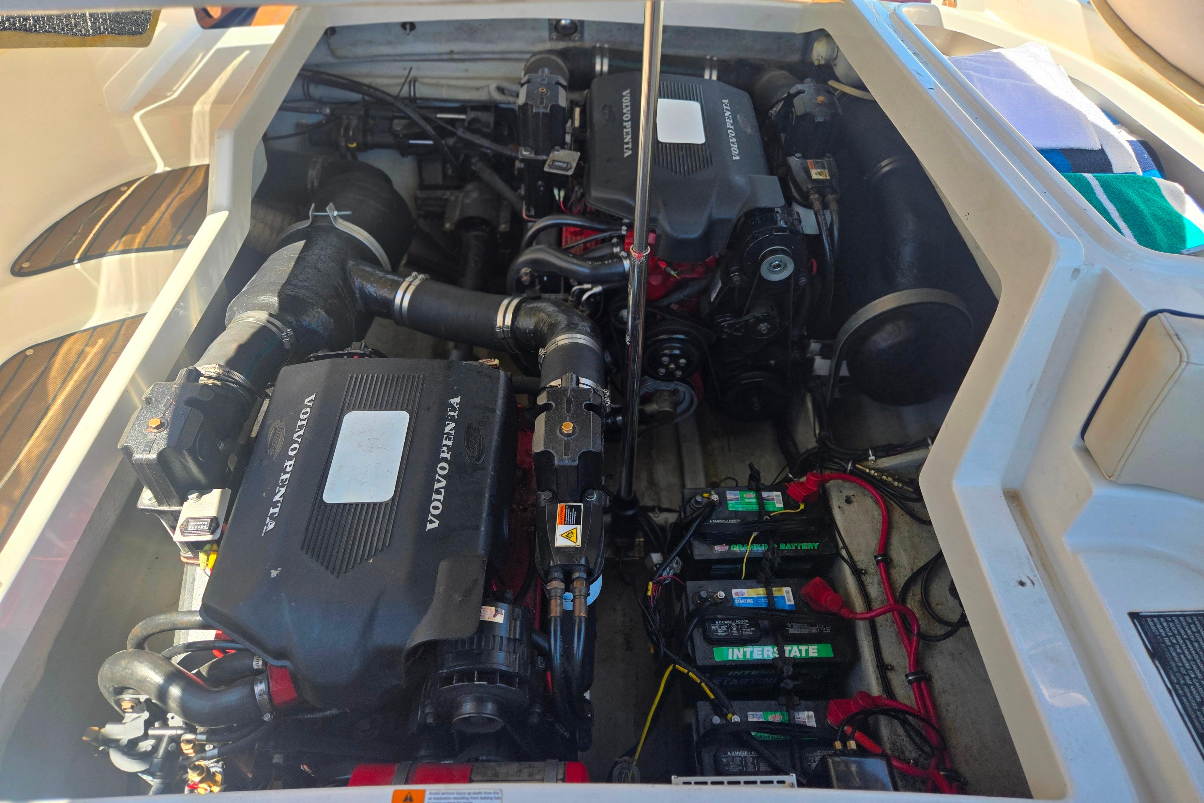 Engine compartment of a 2002 Chris-Craft Launch 28 GT I/O with Volvo Penta engines.