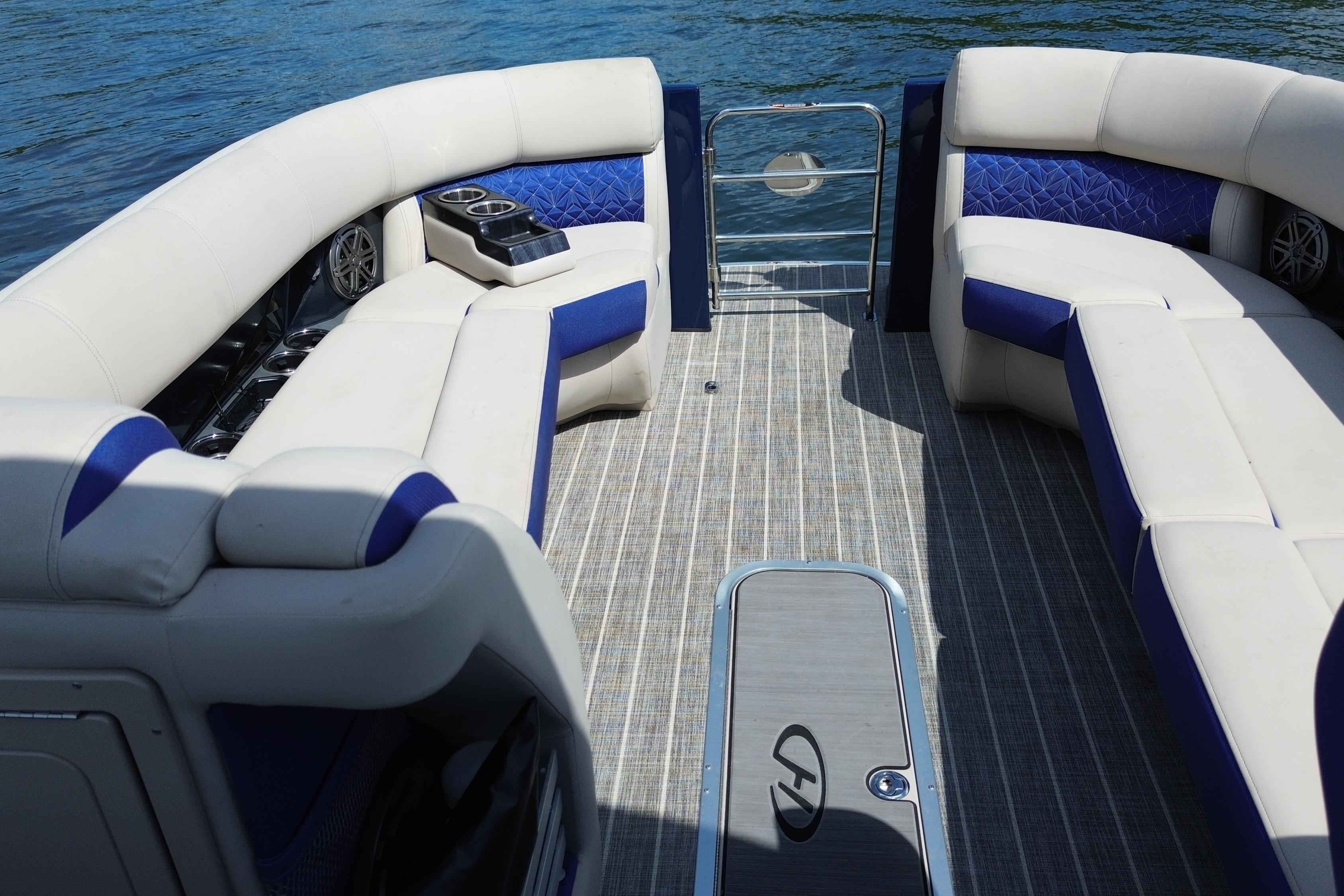 Luxurious seating on 2022 Harris Grand Mariner 250 pontoon boat, featuring elegant upholstery and spacious layout.