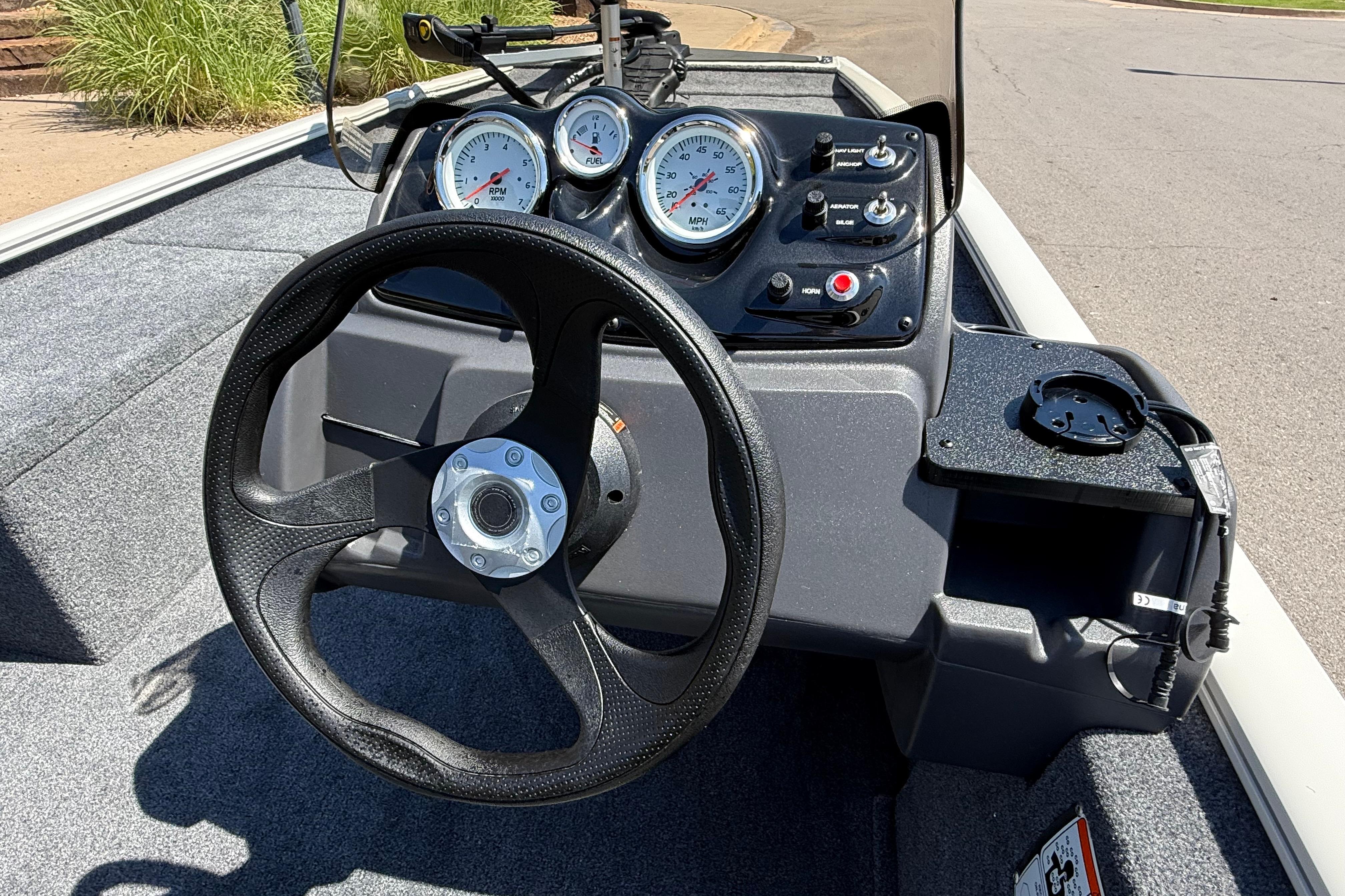Steering console of 2026 Tracker Pro 170 boat with gauges and controls.