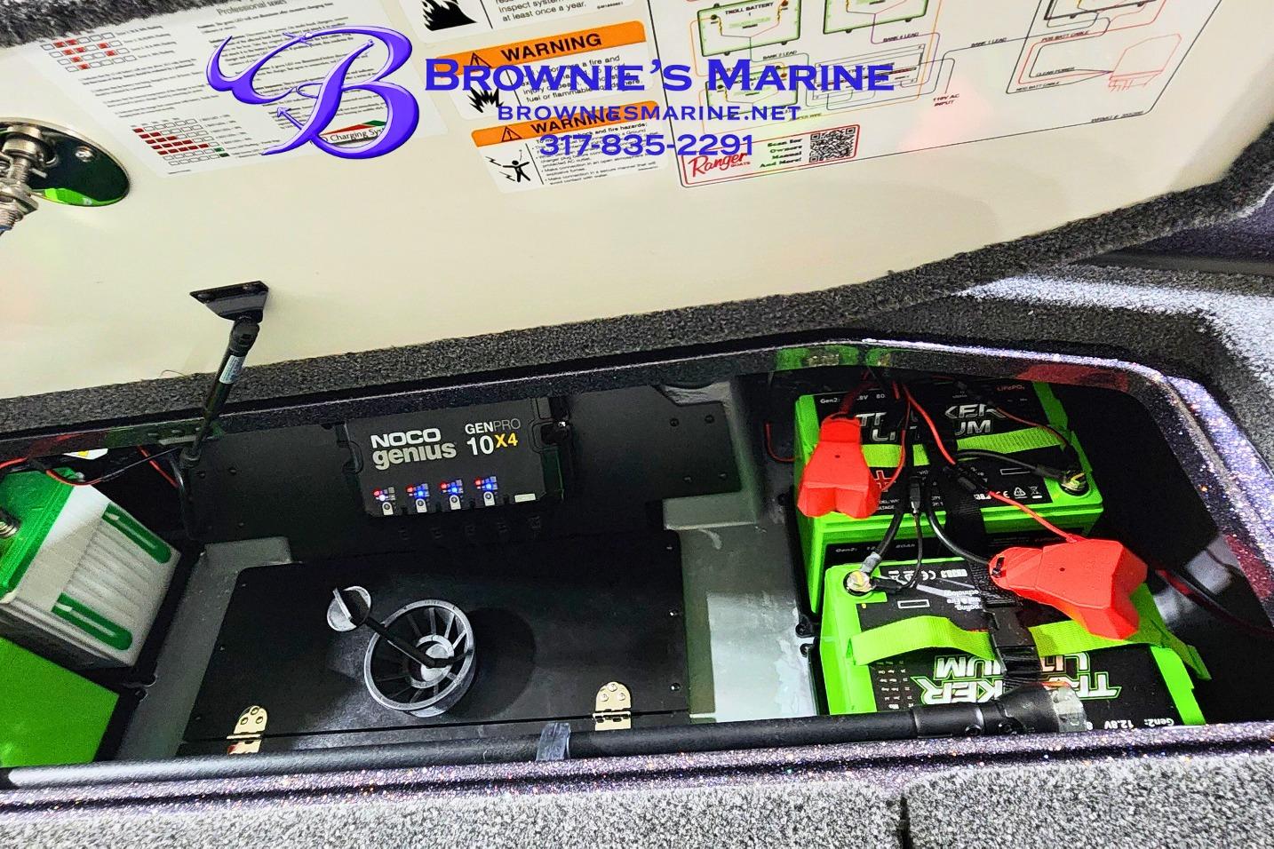 2026 Ranger Z521 boat battery compartment with NOCO Genius GENPRO 10X4 charger and lithium batteries.