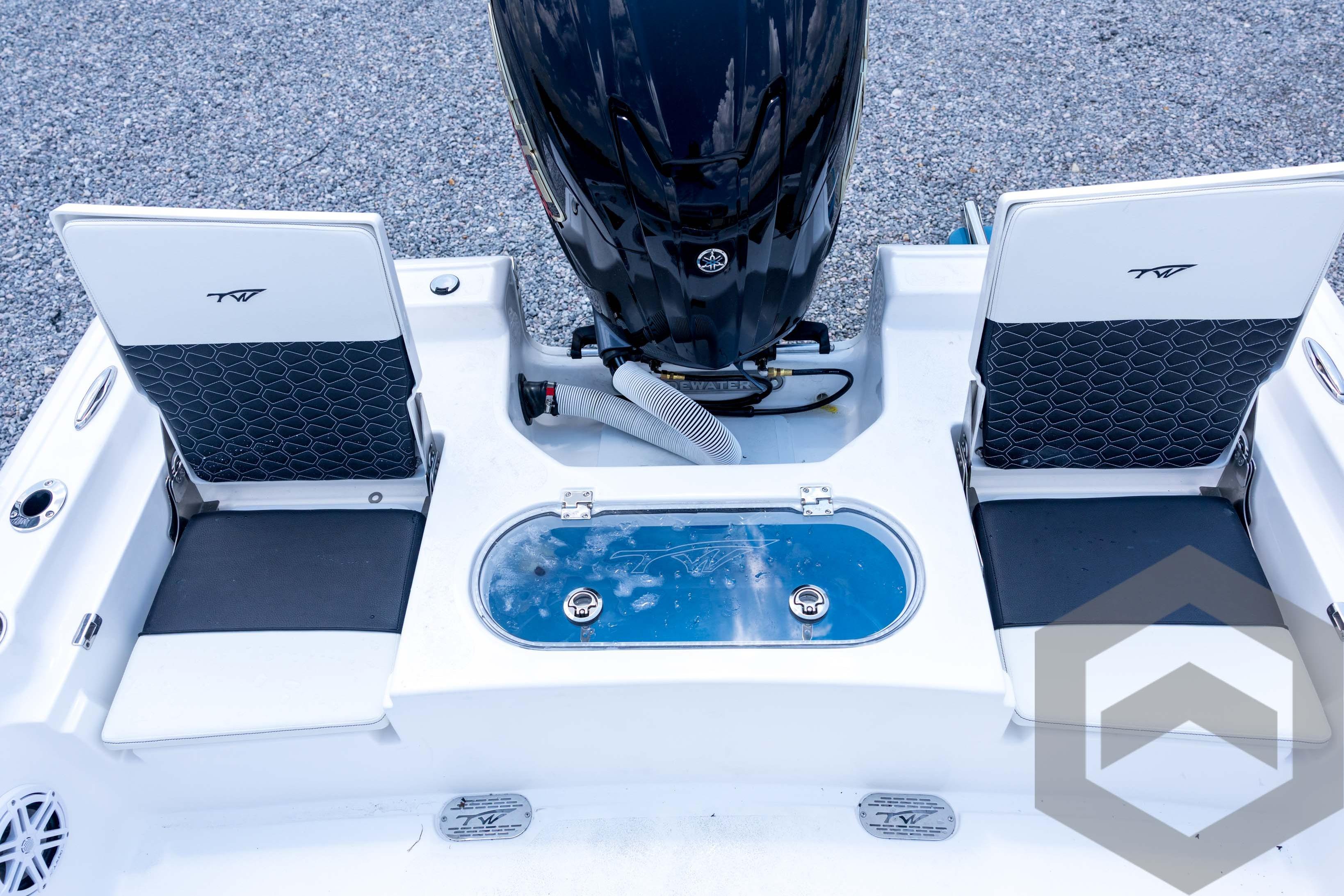 2026 Tidewater 2110 Bay Max boat interior with seating and motor, showcasing modern design.