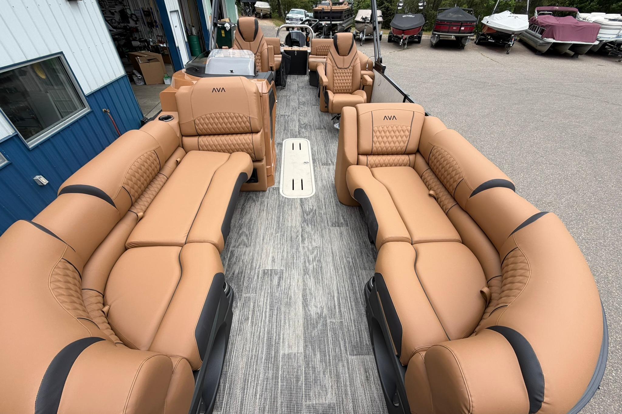 Luxurious interior of 2026 Avalon Catalina Quad Lounge Shift pontoon boat with tan seating.