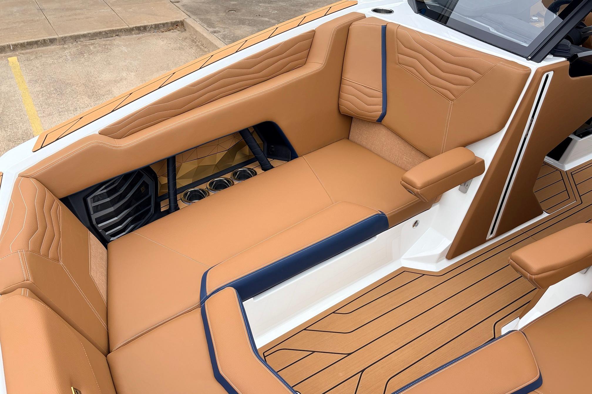 2026 Nautique Super Air Nautique G25 interior with tan leather seating and modern design.