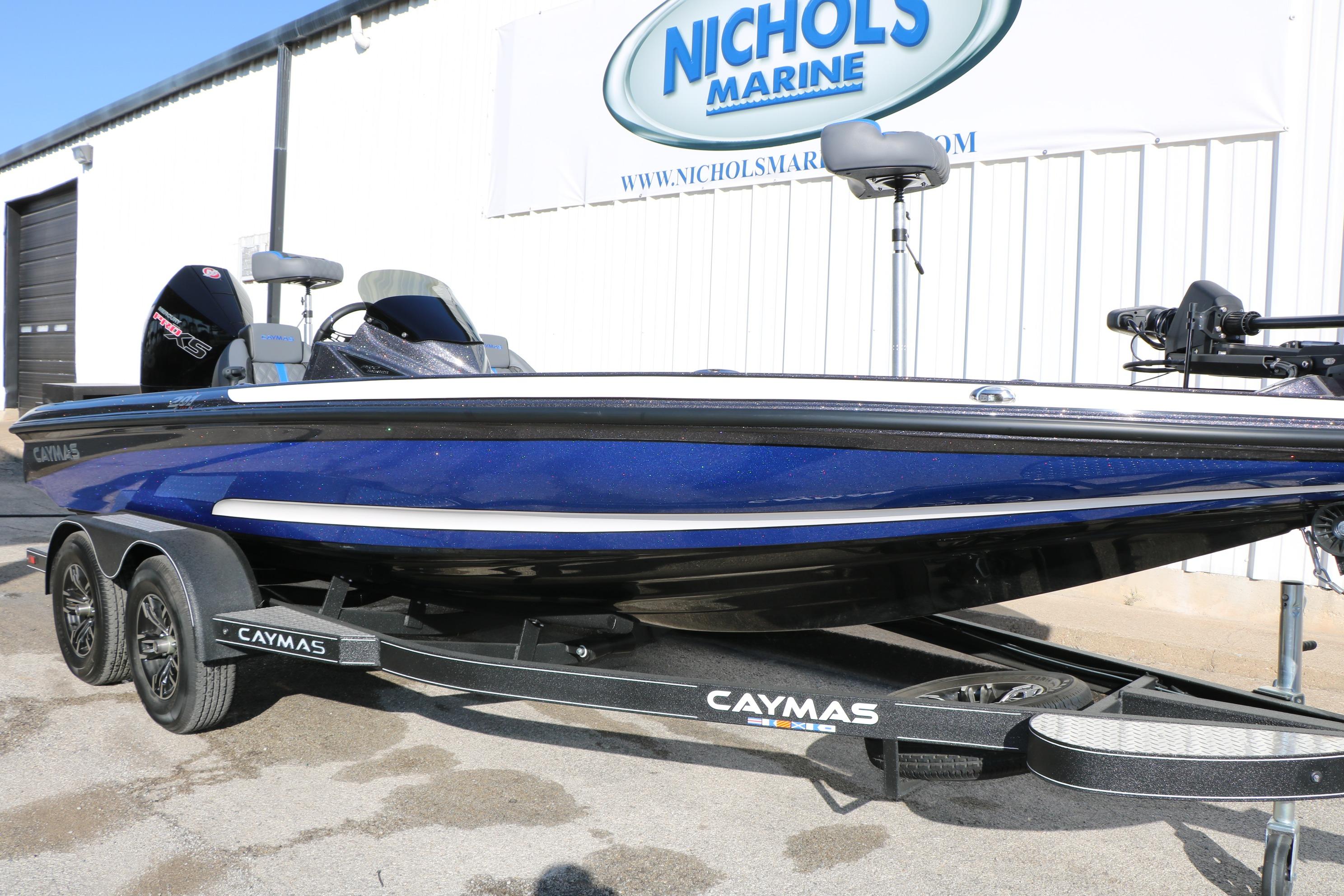 2027 Caymas 201 Pro boat in blue on trailer at Nichols Marine dealership.