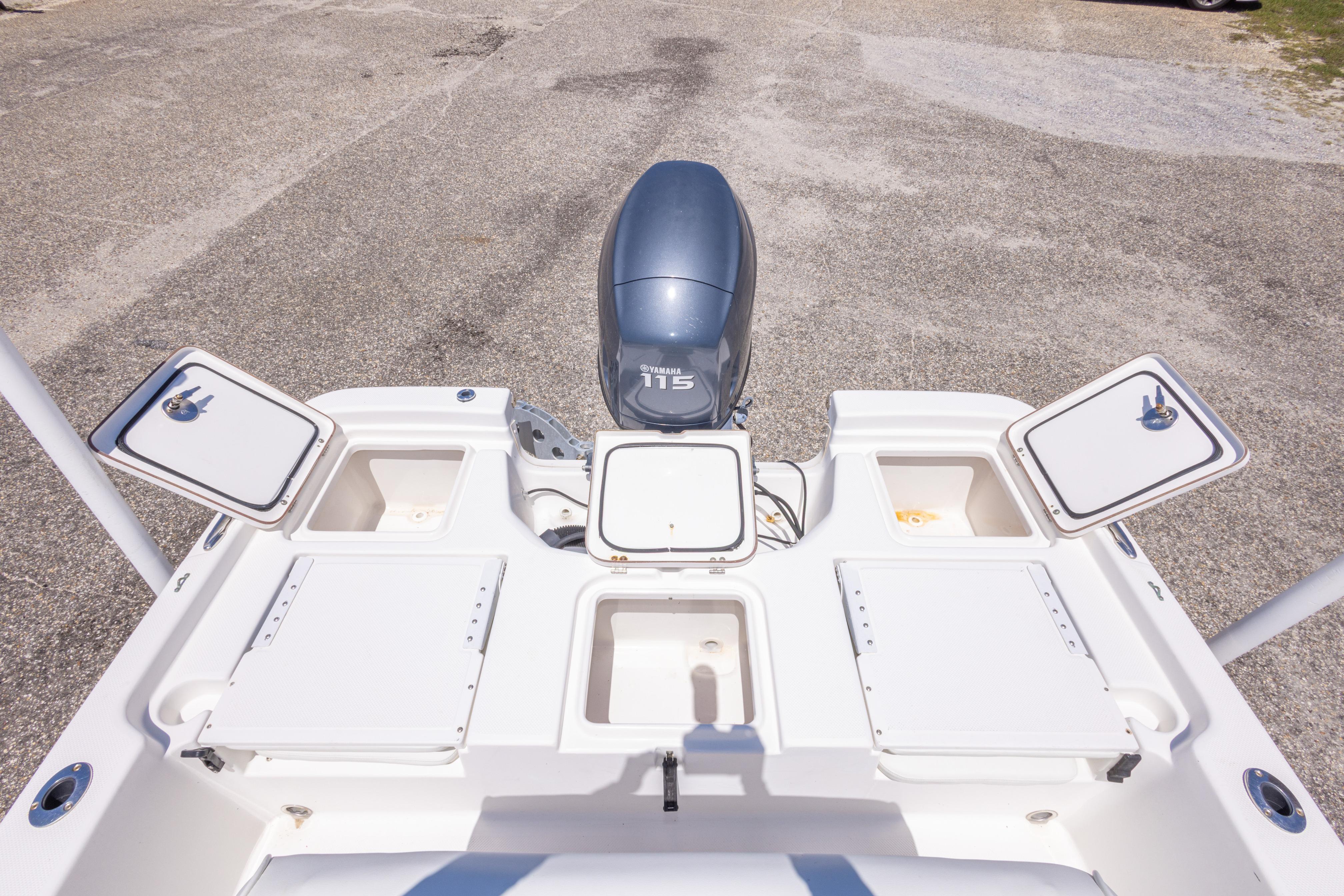 2011 Sea Fox 200XT boat with open storage compartments and Yamaha 115 engine.