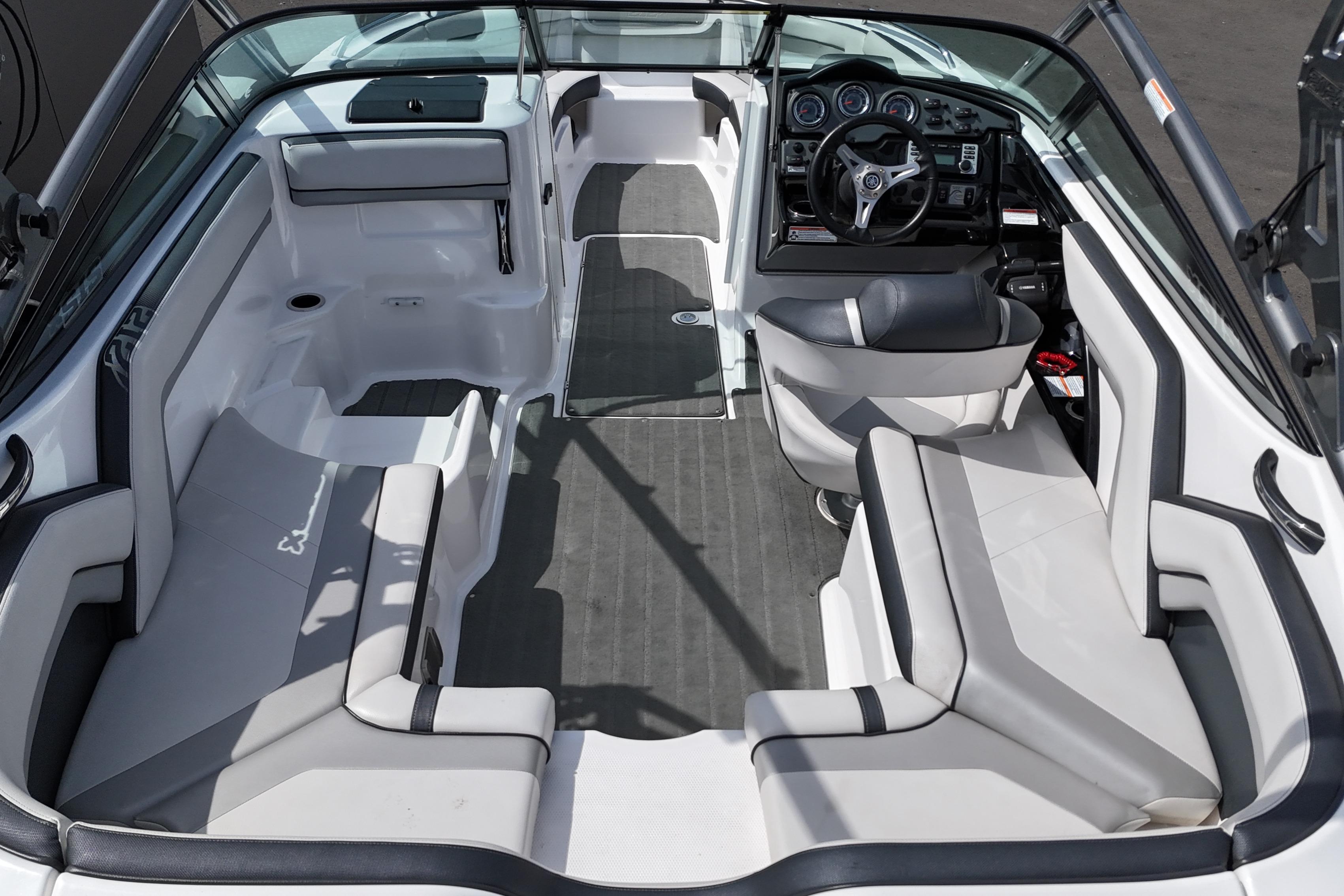 Interior of 2016 Yamaha Boats 212X, featuring spacious seating and modern dashboard design.