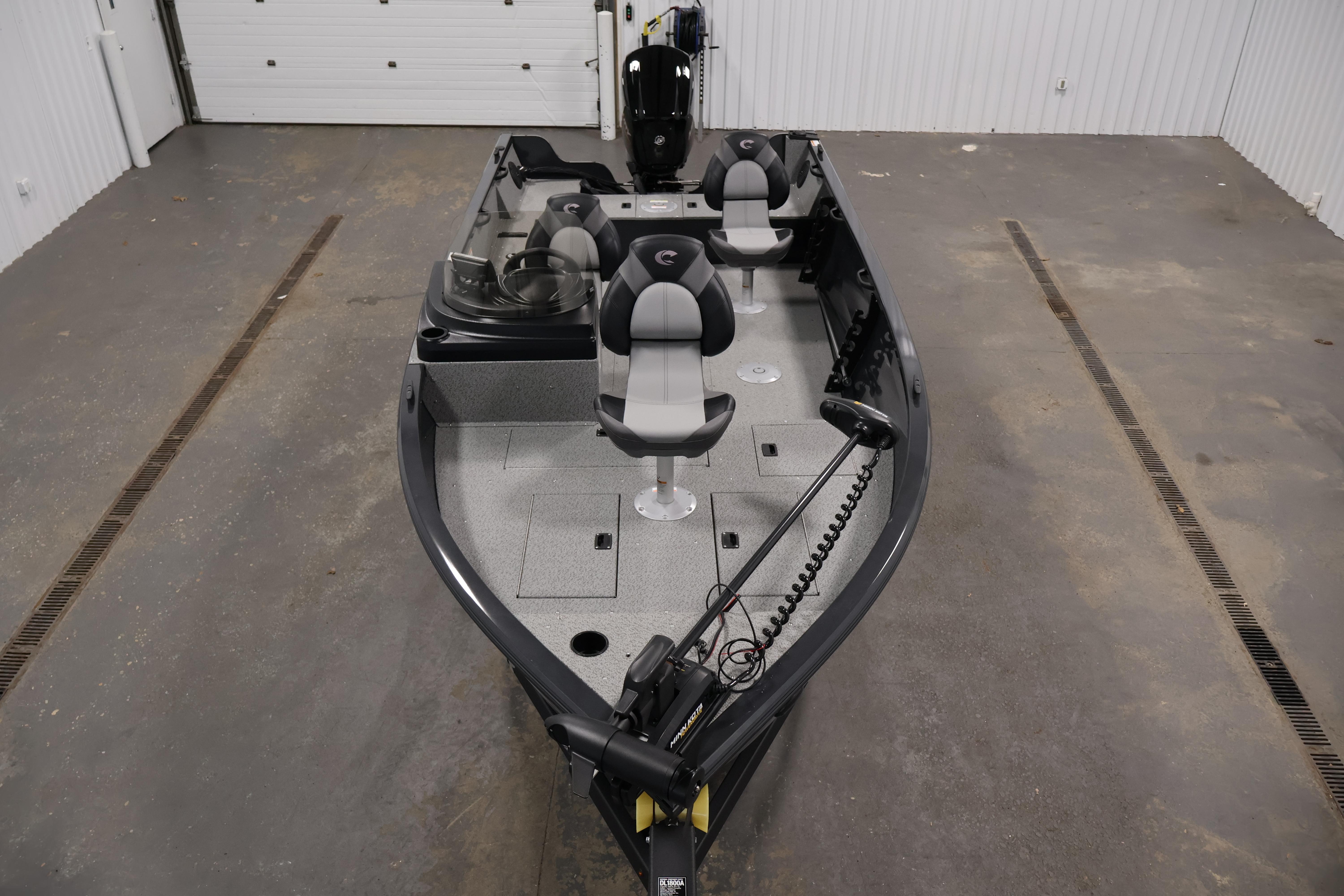 2026 Crestliner 1850 Kodiak SC fishing boat in a garage setting.