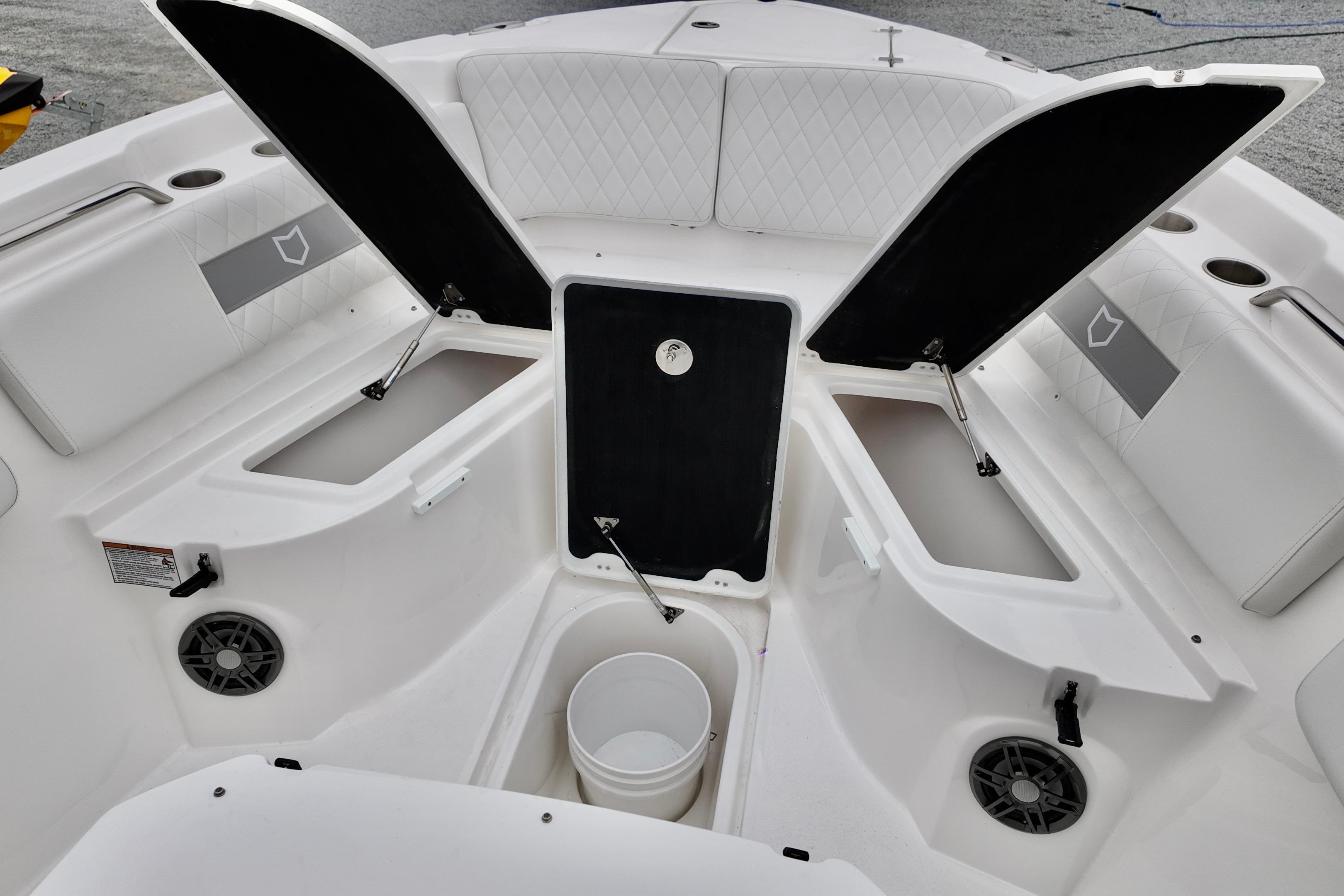 2026 Sea Fox 268 Commander boat interior with open storage compartments and seating.