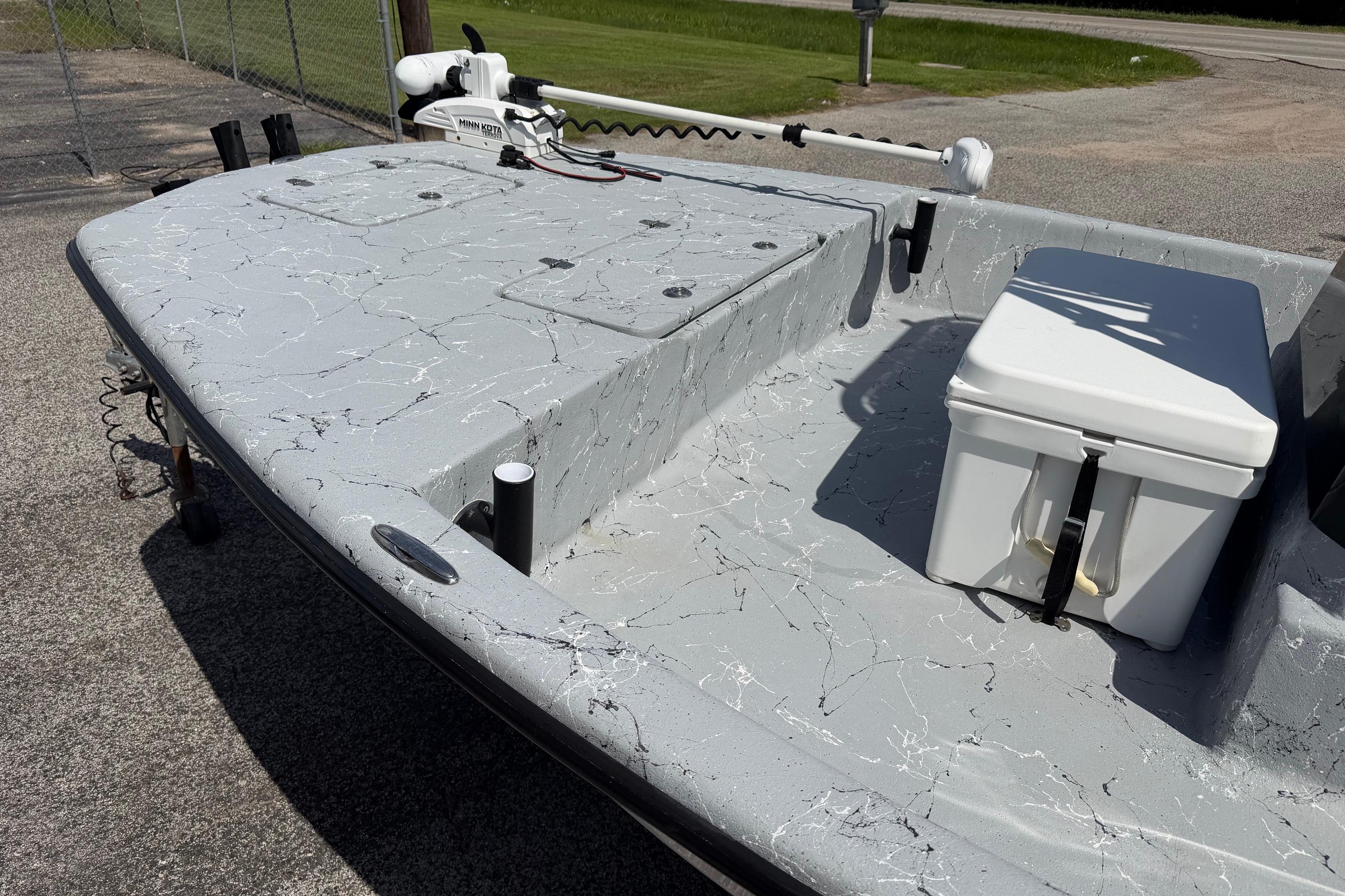 2023 Haynie 23 Super Cat boat deck with cooler and trolling motor.