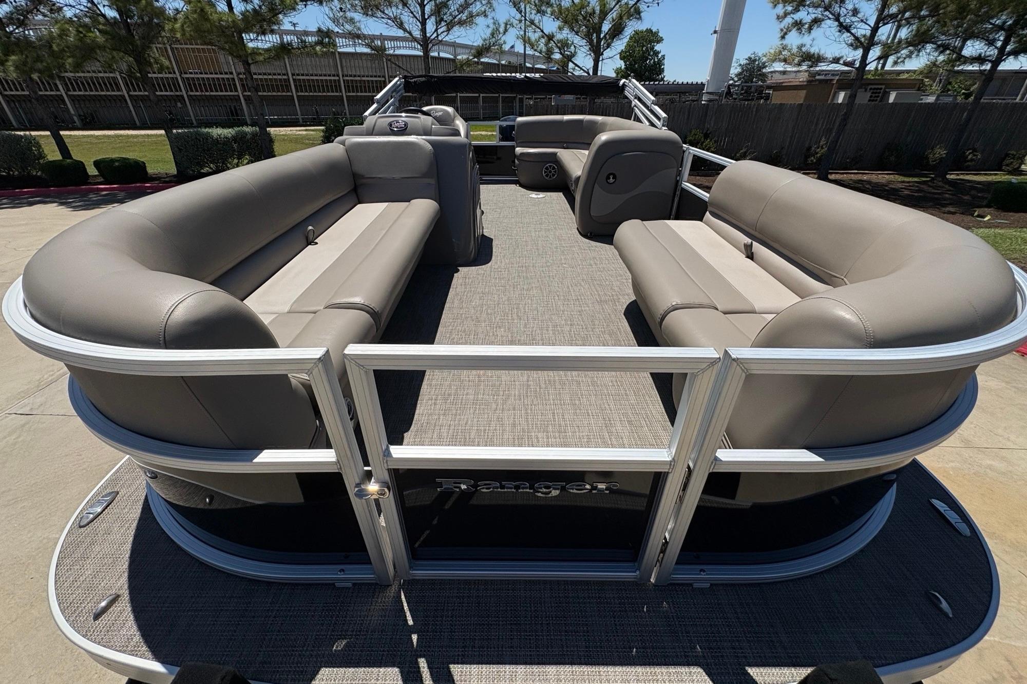 2024 Ranger Reata 200C pontoon boat with spacious seating and modern design.