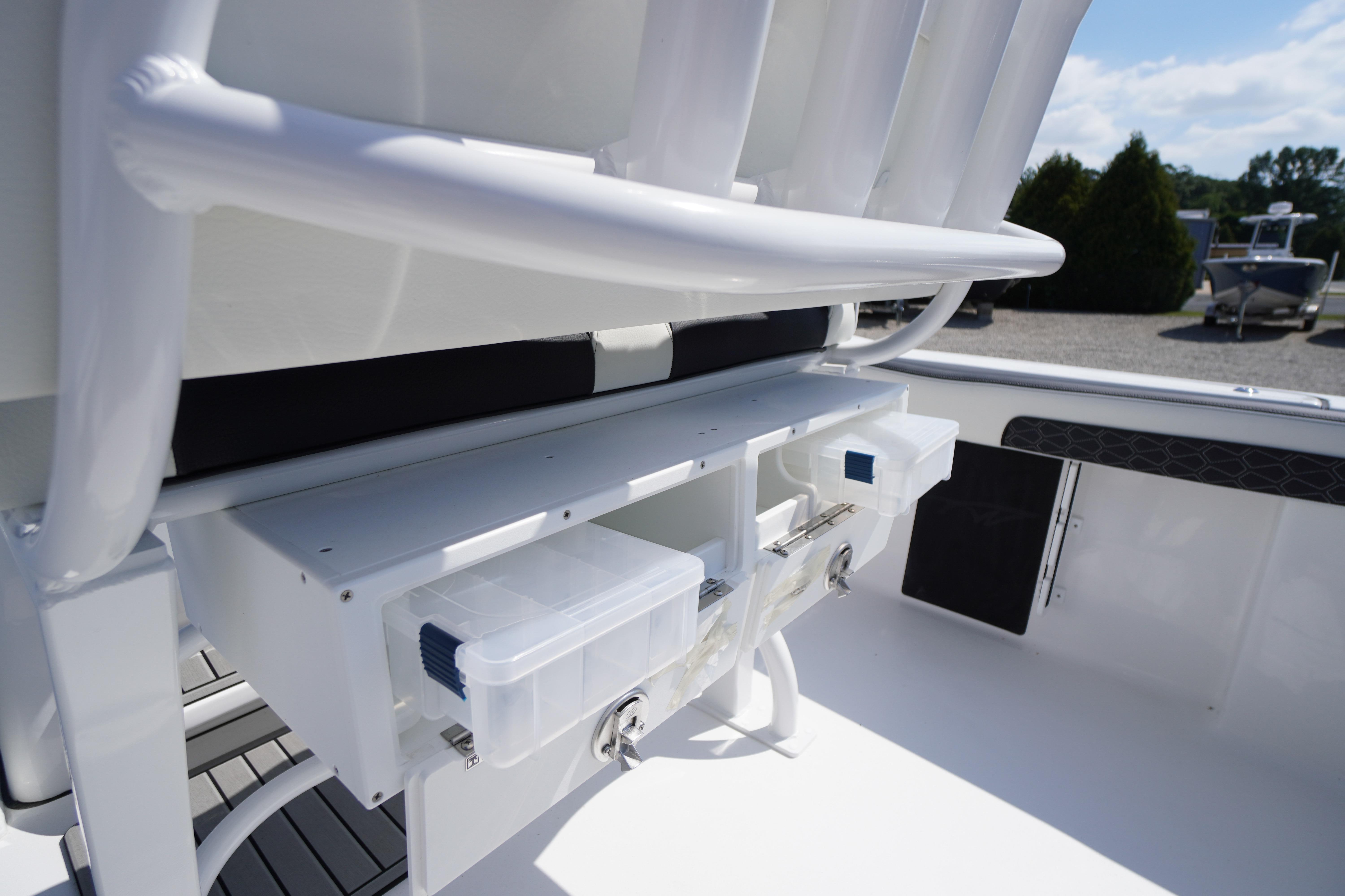 2026 Tidewater 220 CC Adventure boat interior with storage compartments and seating.