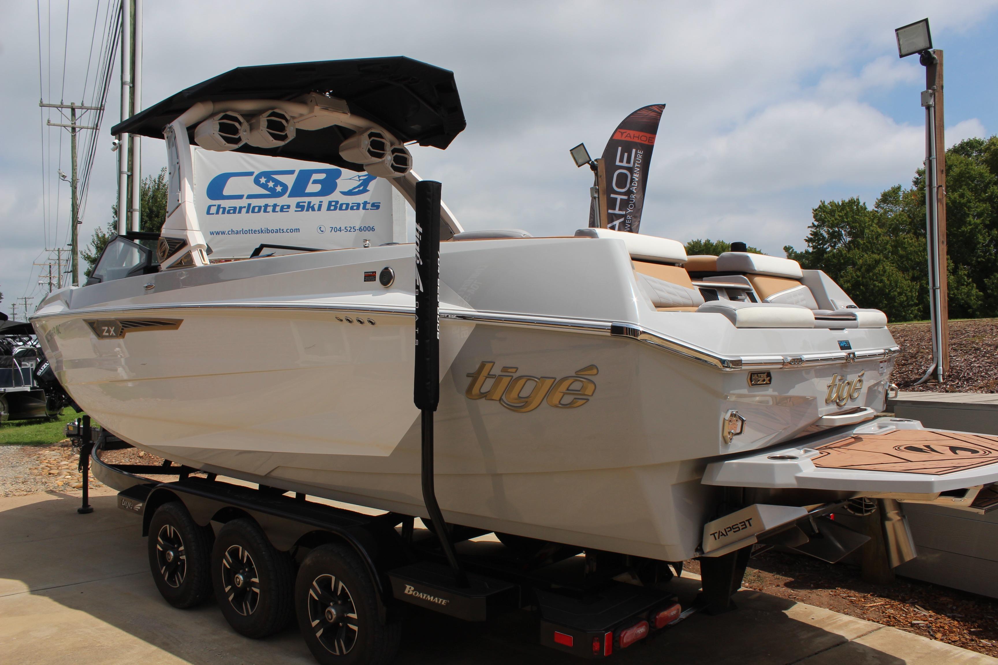 2024 Tigé Ultré 25ZX boat on trailer at Charlotte Ski Boats dealership.