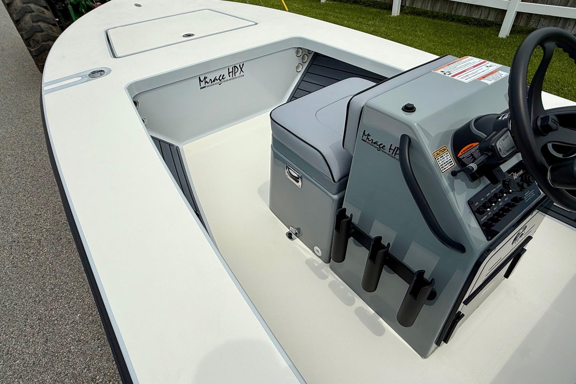 2026 Maverick 17 HPX-S boat interior with console and seating, showcasing sleek design.