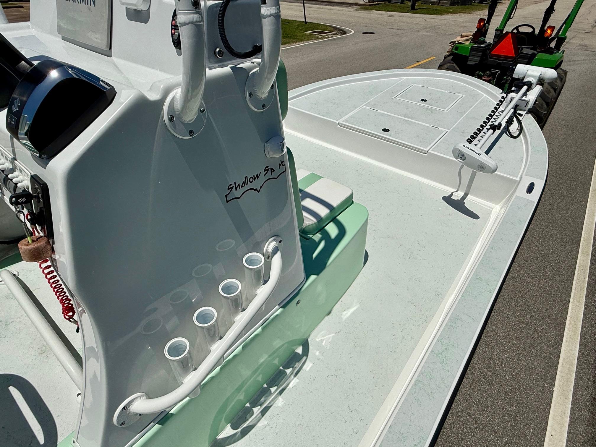 2023 Shallow Sport 24 Sport boat on trailer, featuring sleek design and modern equipment.