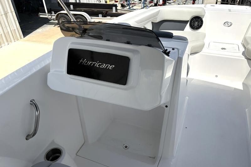 2026 Hurricane SunDeck Sport 2050 OB boat interior with steering console and seating area.