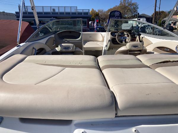 2008 Chaparral 210 SSi boat interior with beige seating and steering wheel.