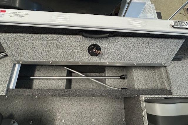 Storage compartment of 2026 Lund 1650 Rebel XL SS boat, featuring organized interior space.
