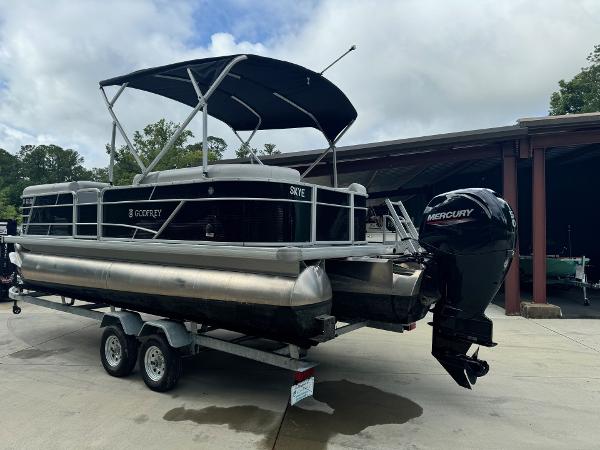 2023 Godfrey 2286 pontoon boat with Mercury outboard motor on trailer.
