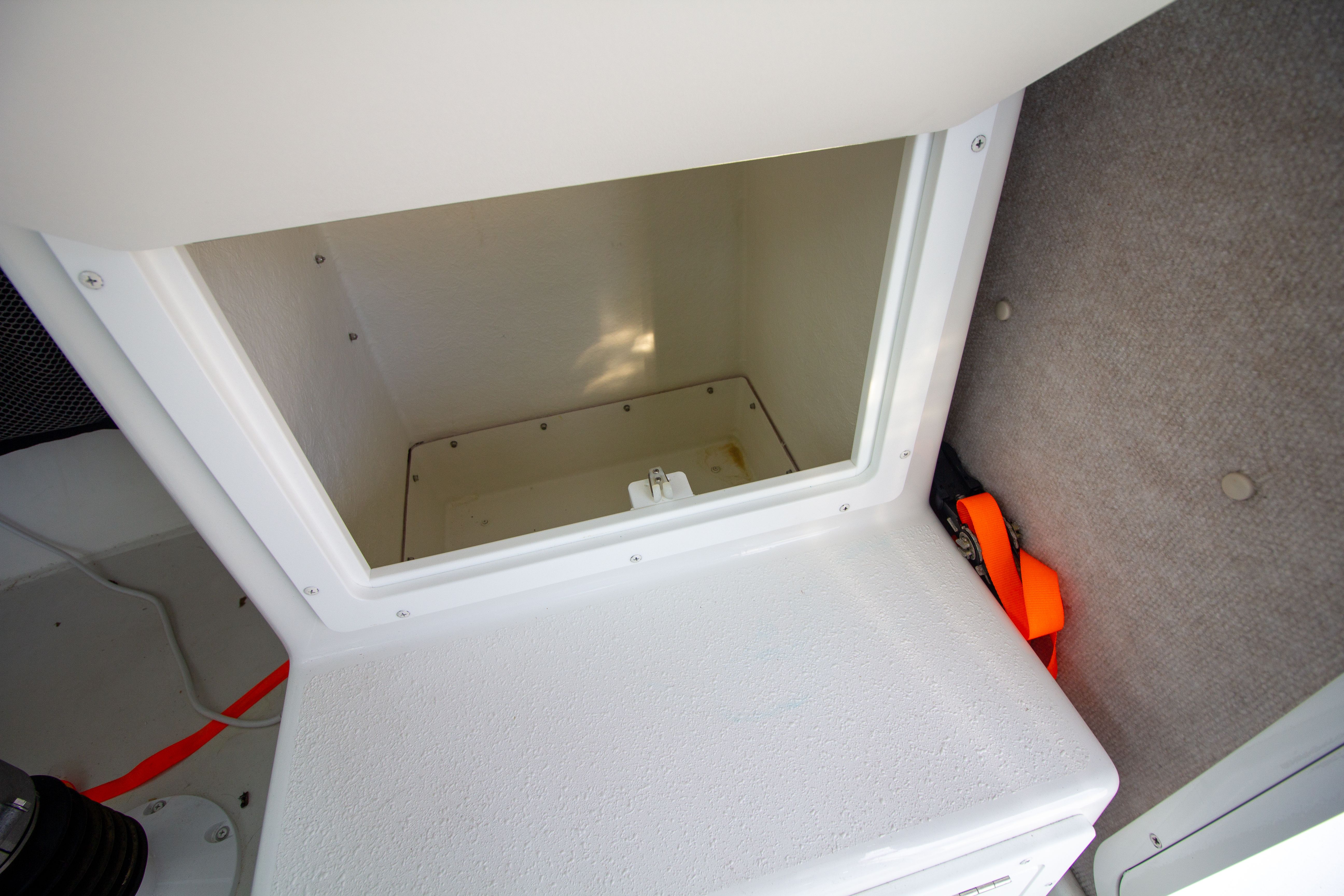 Interior of 2022 Parker 2520 XLD Sport Cabin with storage compartment.