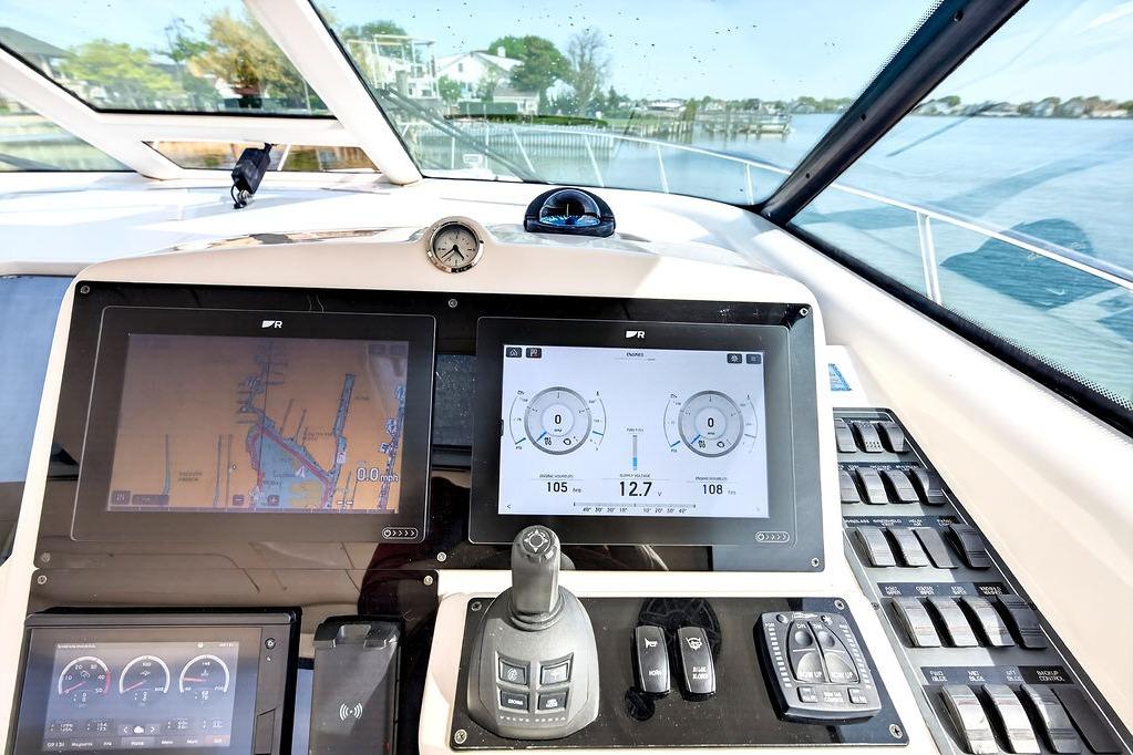 Dashboard of a 2006 Tiara Yachts 4300 Sovran with navigation screens and controls.
