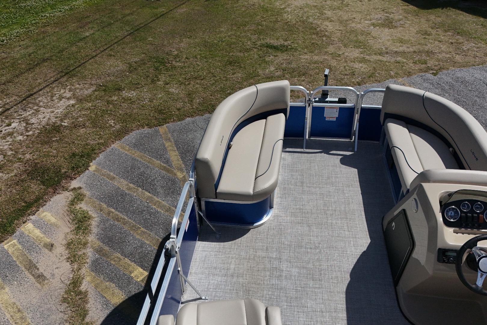 2024 Lowe Ultra 200 Cruise pontoon boat with spacious seating and modern dashboard.