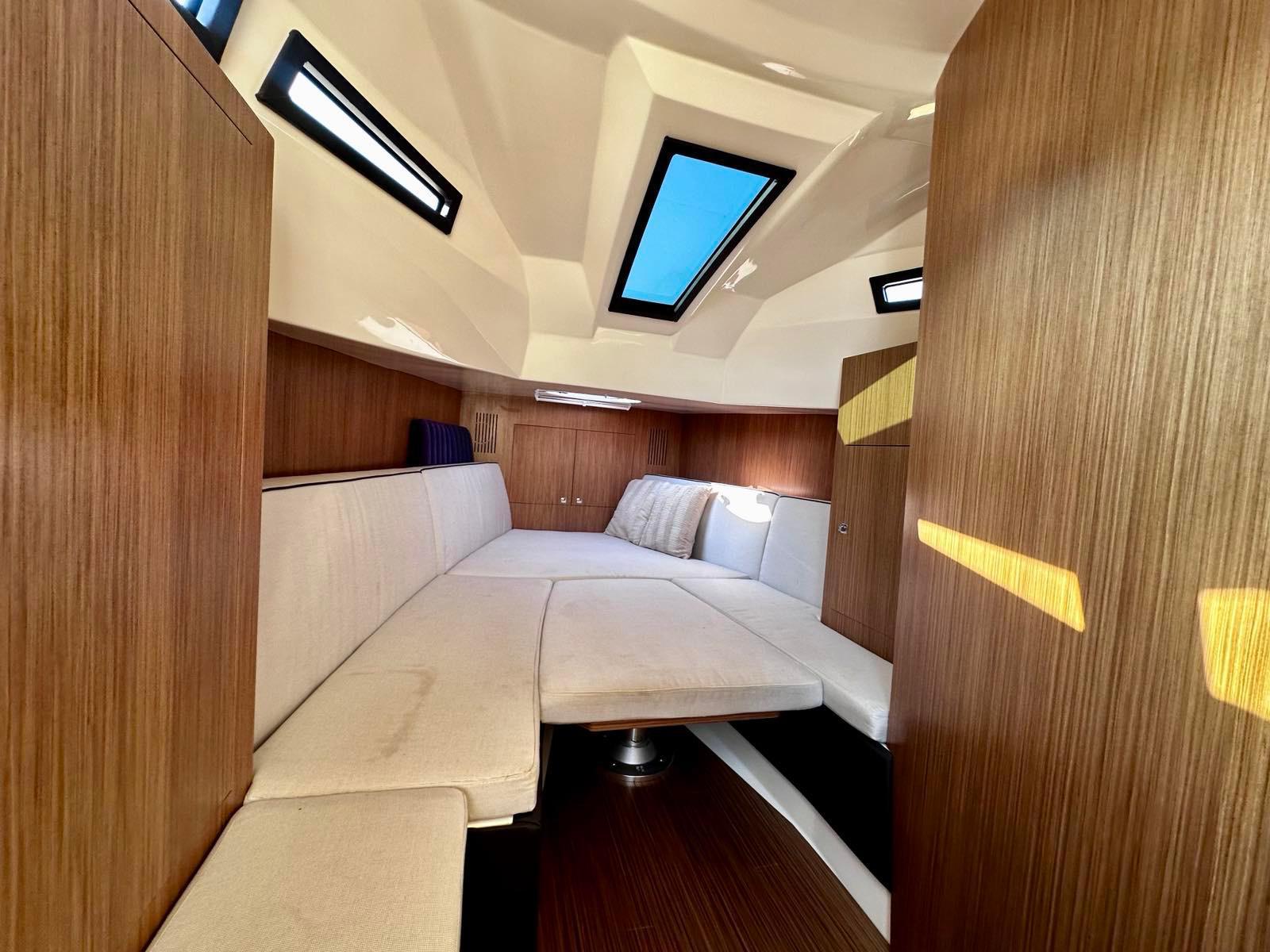 Interior of 2020 Capelli Tempest 50 boat with modern wood finish and skylights.