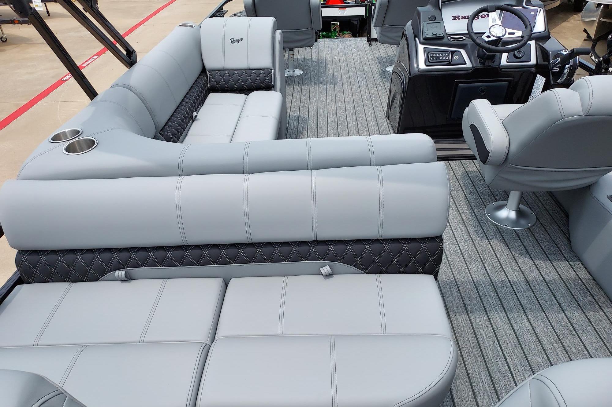 Luxurious interior of 2026 Ranger 220F boat with plush seating and modern dashboard.