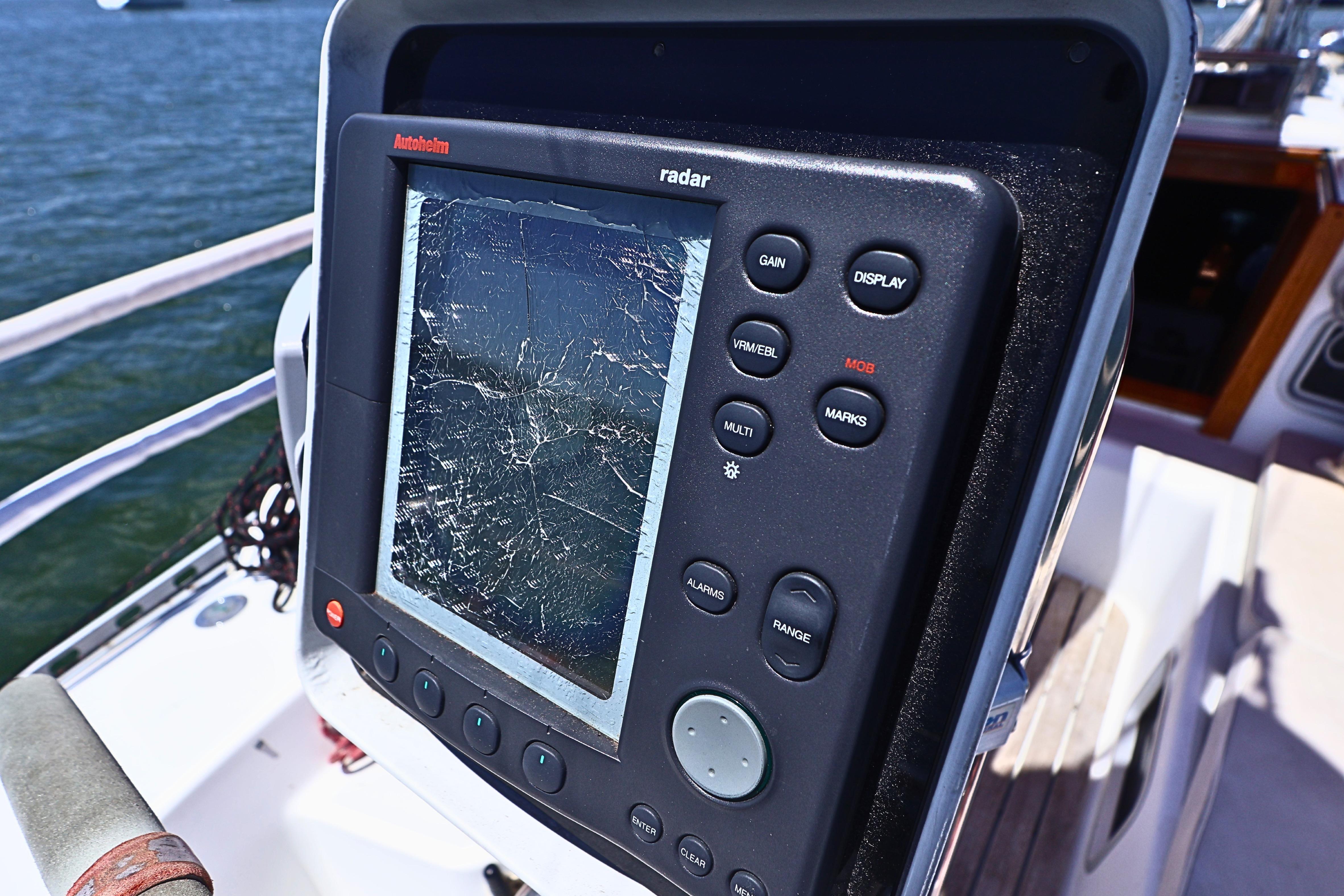 Cracked radar screen on 1989 J Boat J 40, displaying damaged navigation equipment.