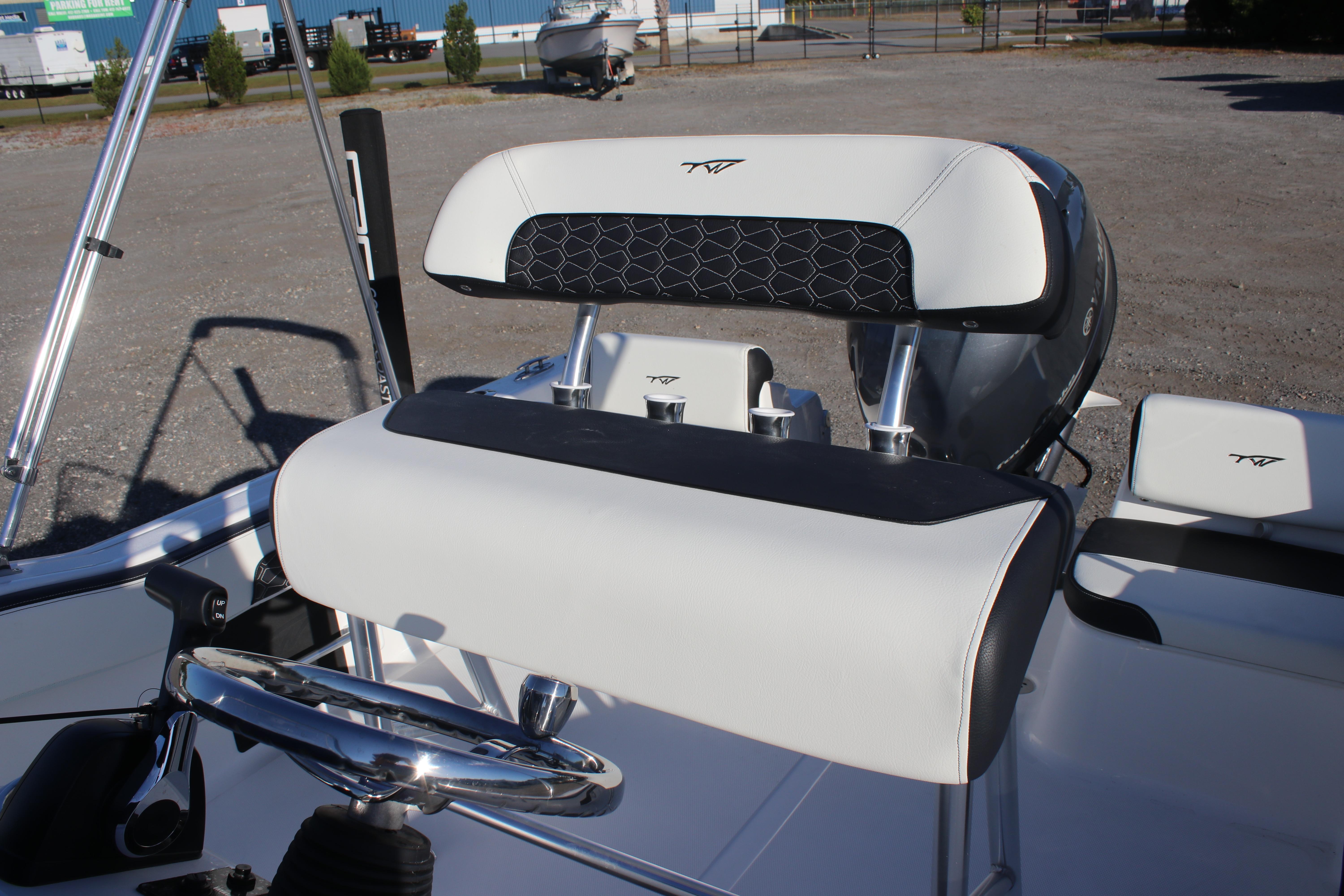 2026 Tidewater 180 CC Adventure boat interior with steering wheel and seating.