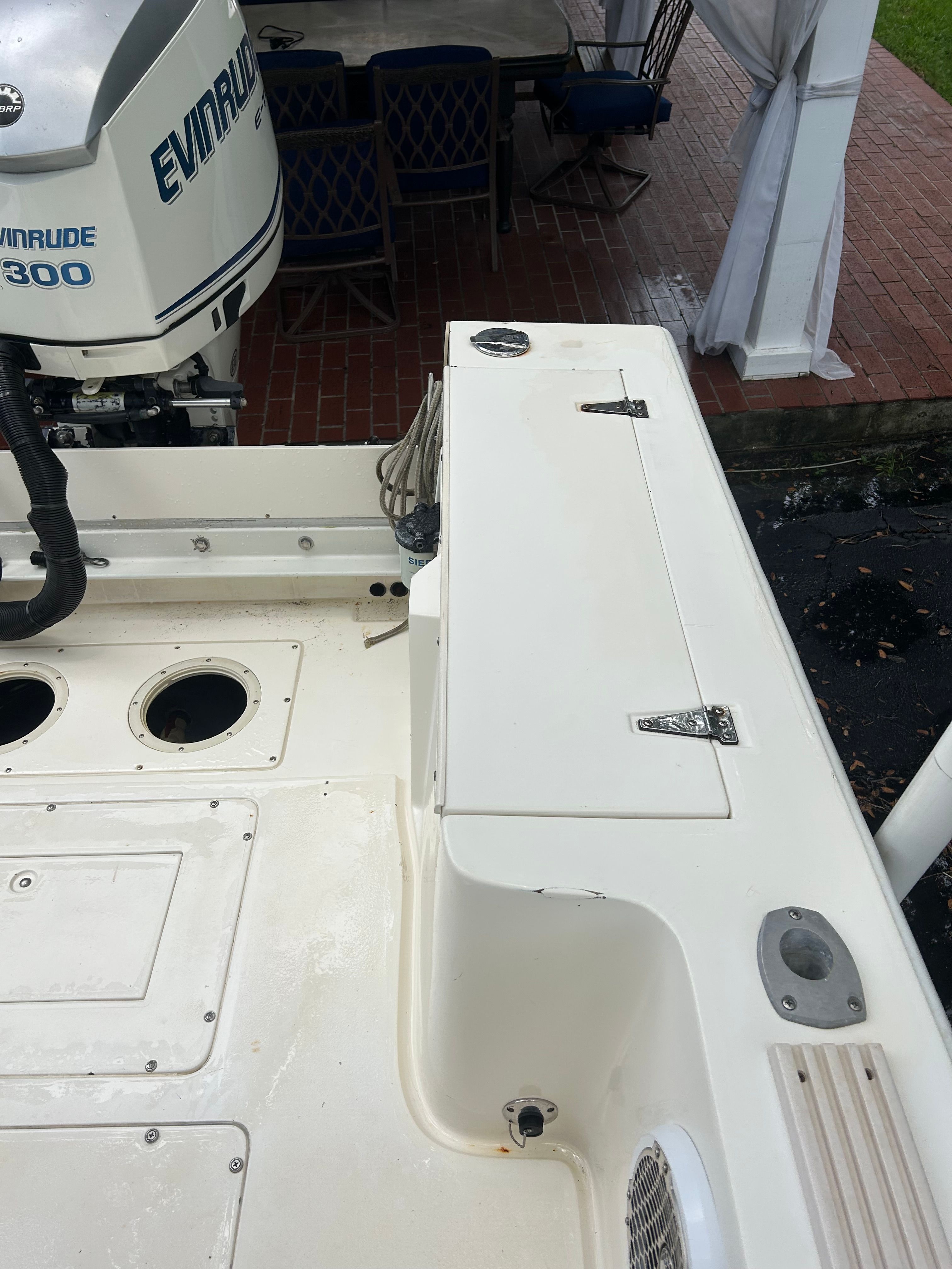 1992 Mako 221 boat with Evinrude motor, deck view.