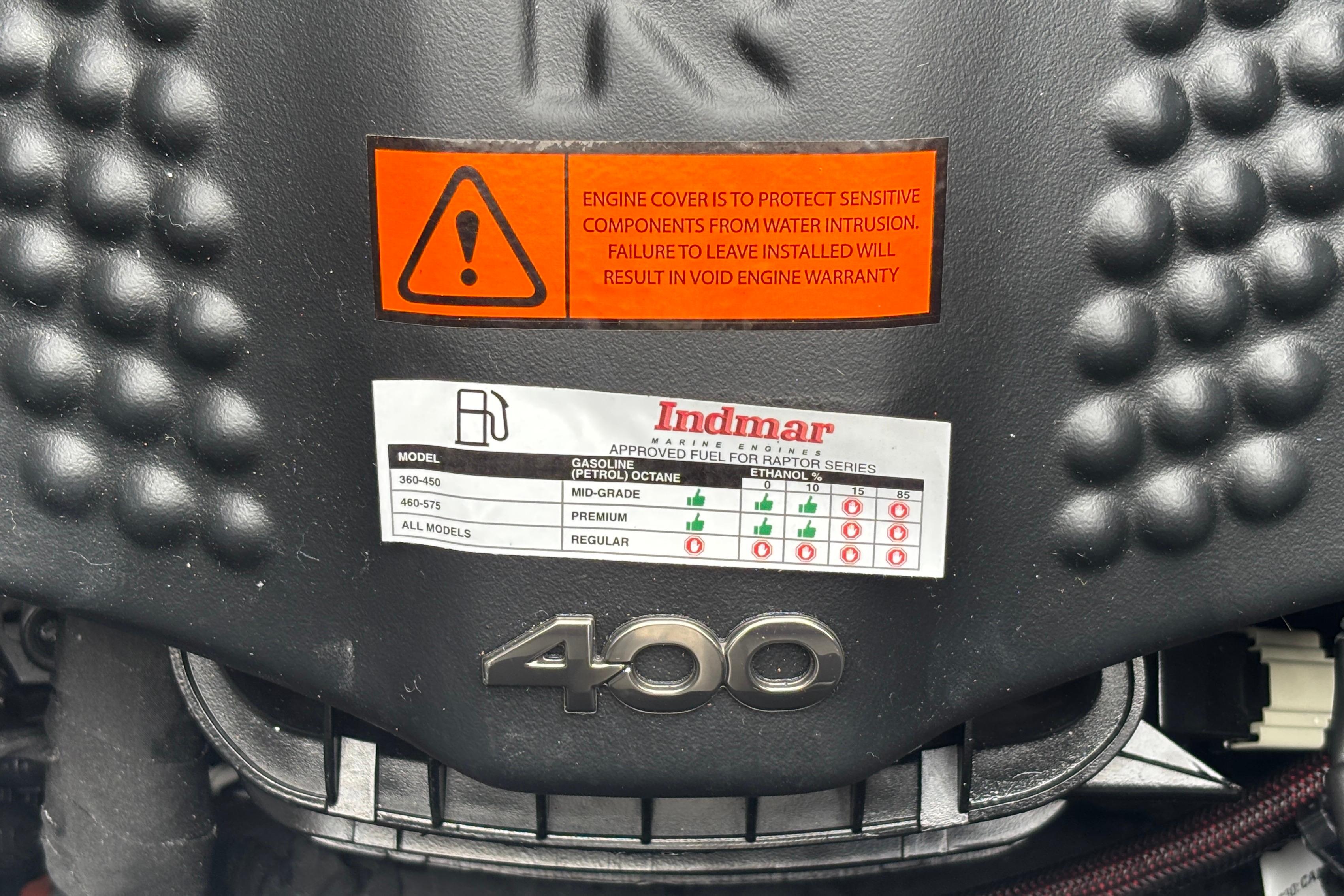 Engine cover of 2026 MB B52 23 Classic with fuel specifications and warning label.