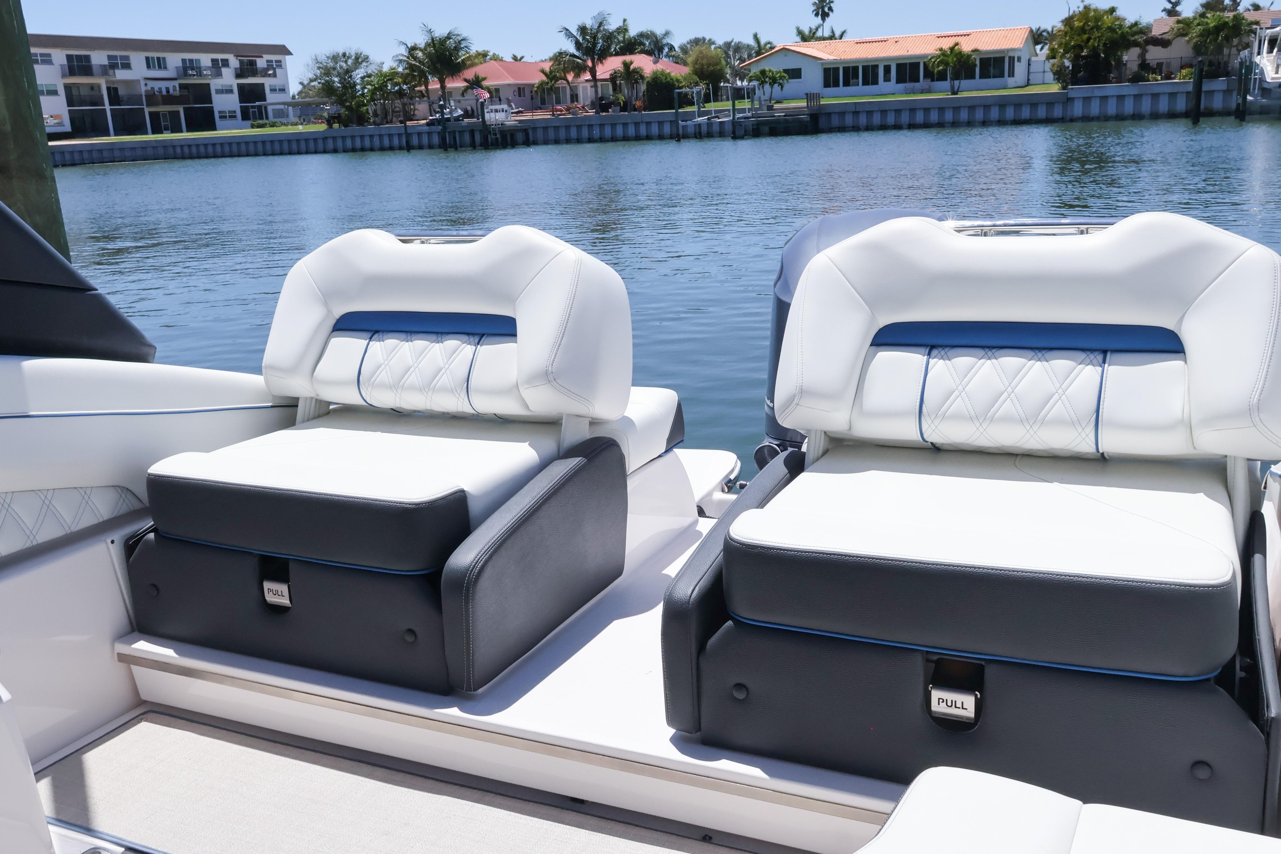 Luxury seating on 2020 Regal LX4 boat by waterfront homes.