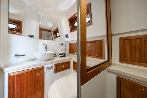 Luxurious bathroom in 2023 Vento V40 Retro Classic Open yacht with wooden cabinets and modern fixtures.
