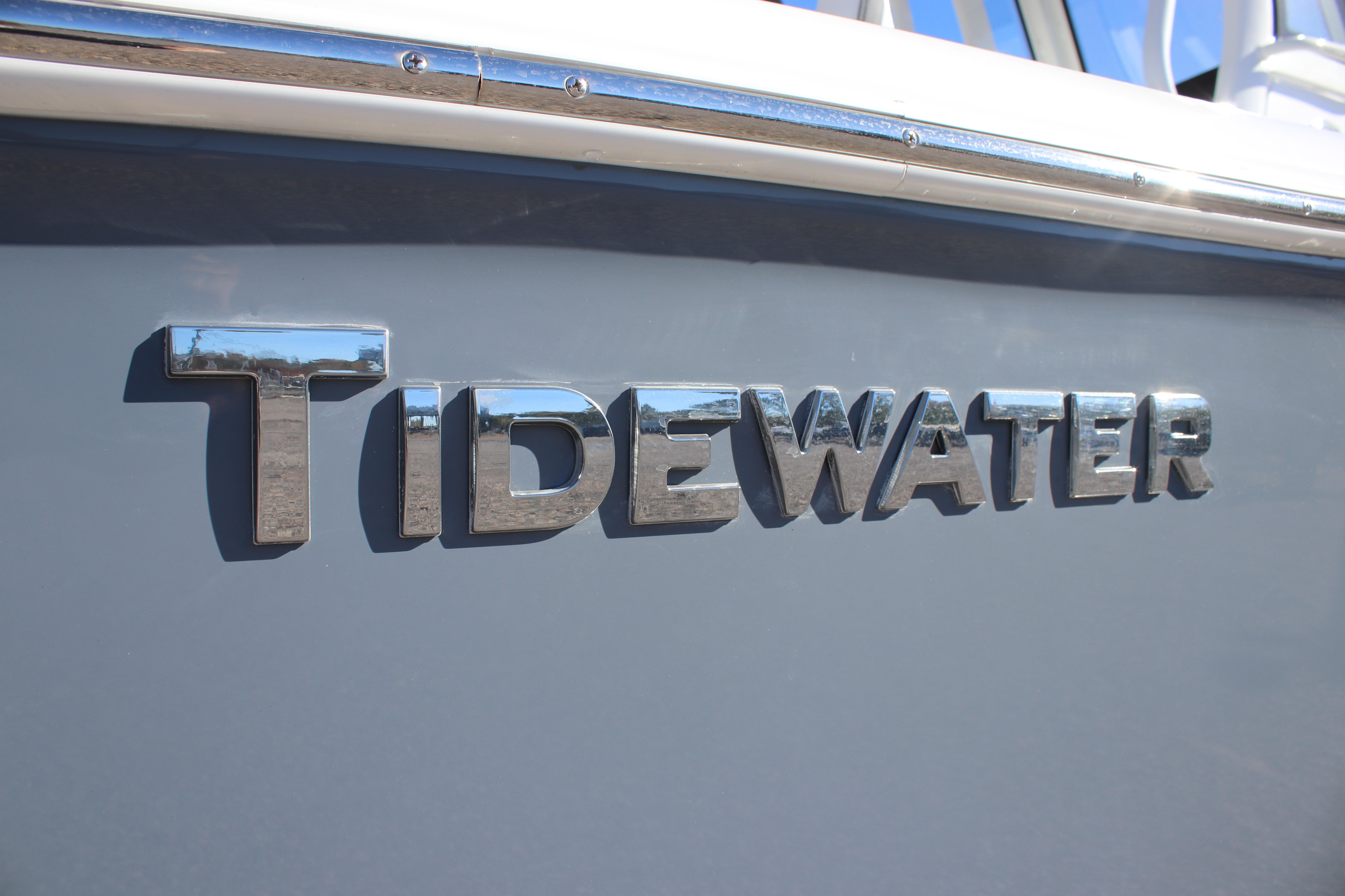 2026 Tidewater 232 CC Adventure boat logo on sleek gray hull.