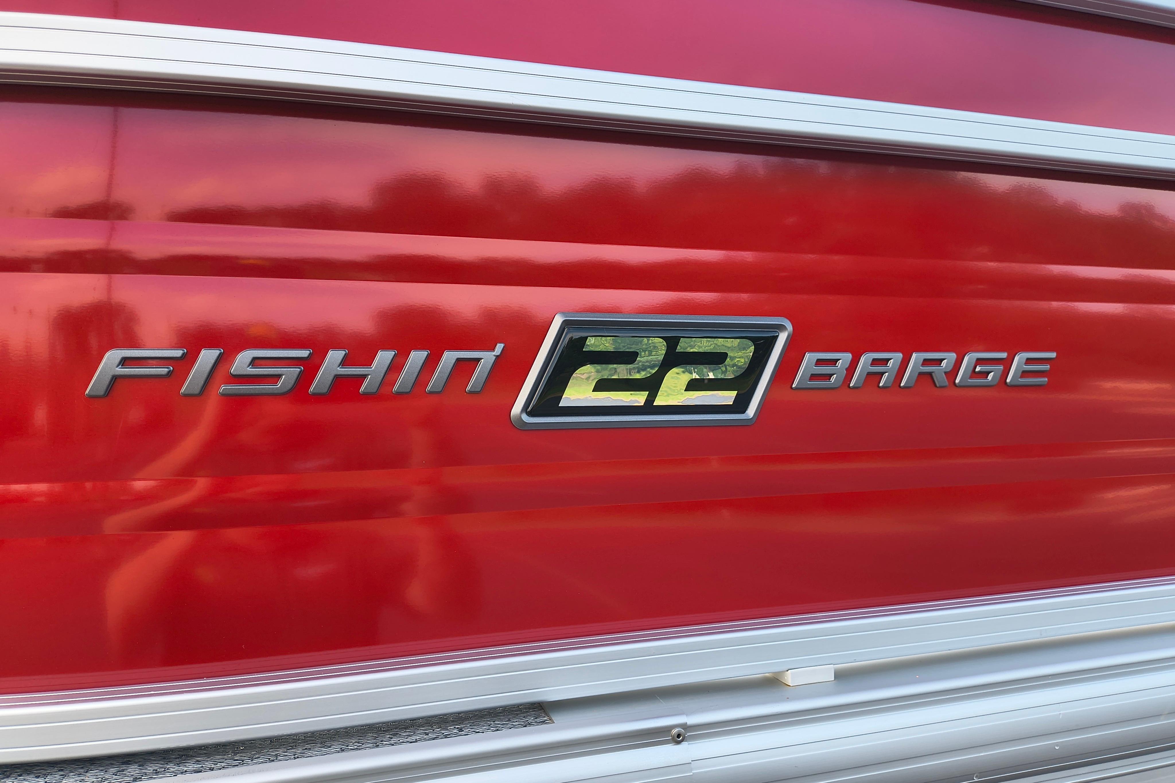 Red Sun Tracker Fishin' Barge 22 DLX, 2026 model, with sleek metallic lettering.