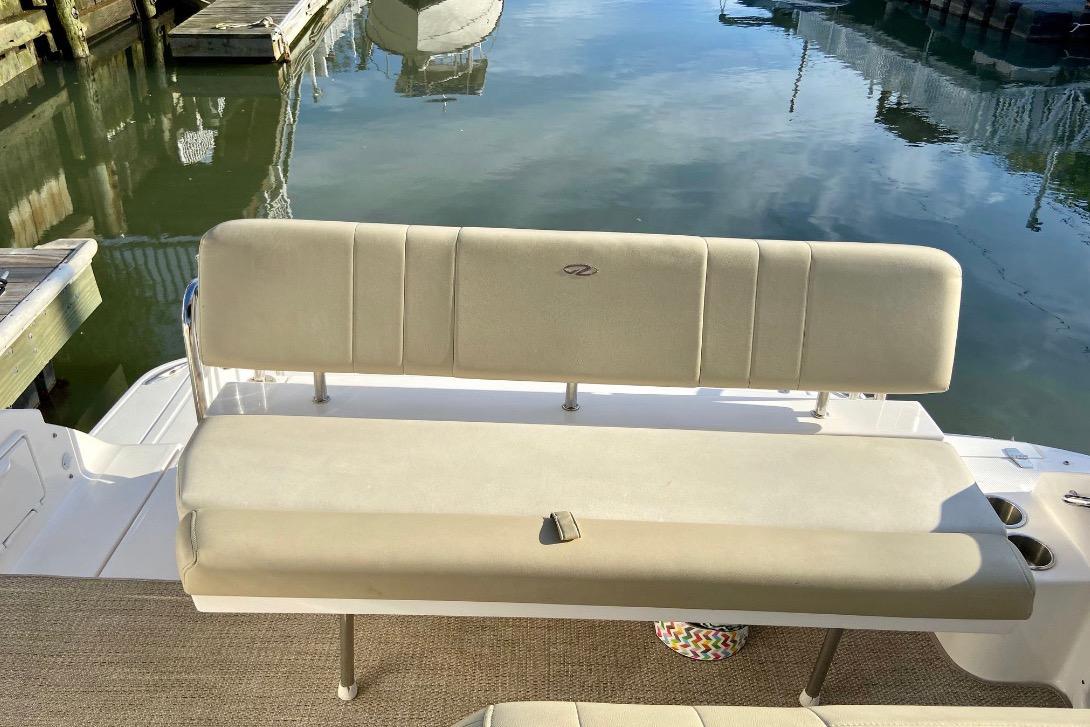 2012 Regal 35 Express Cruiser boat seating by the water.
