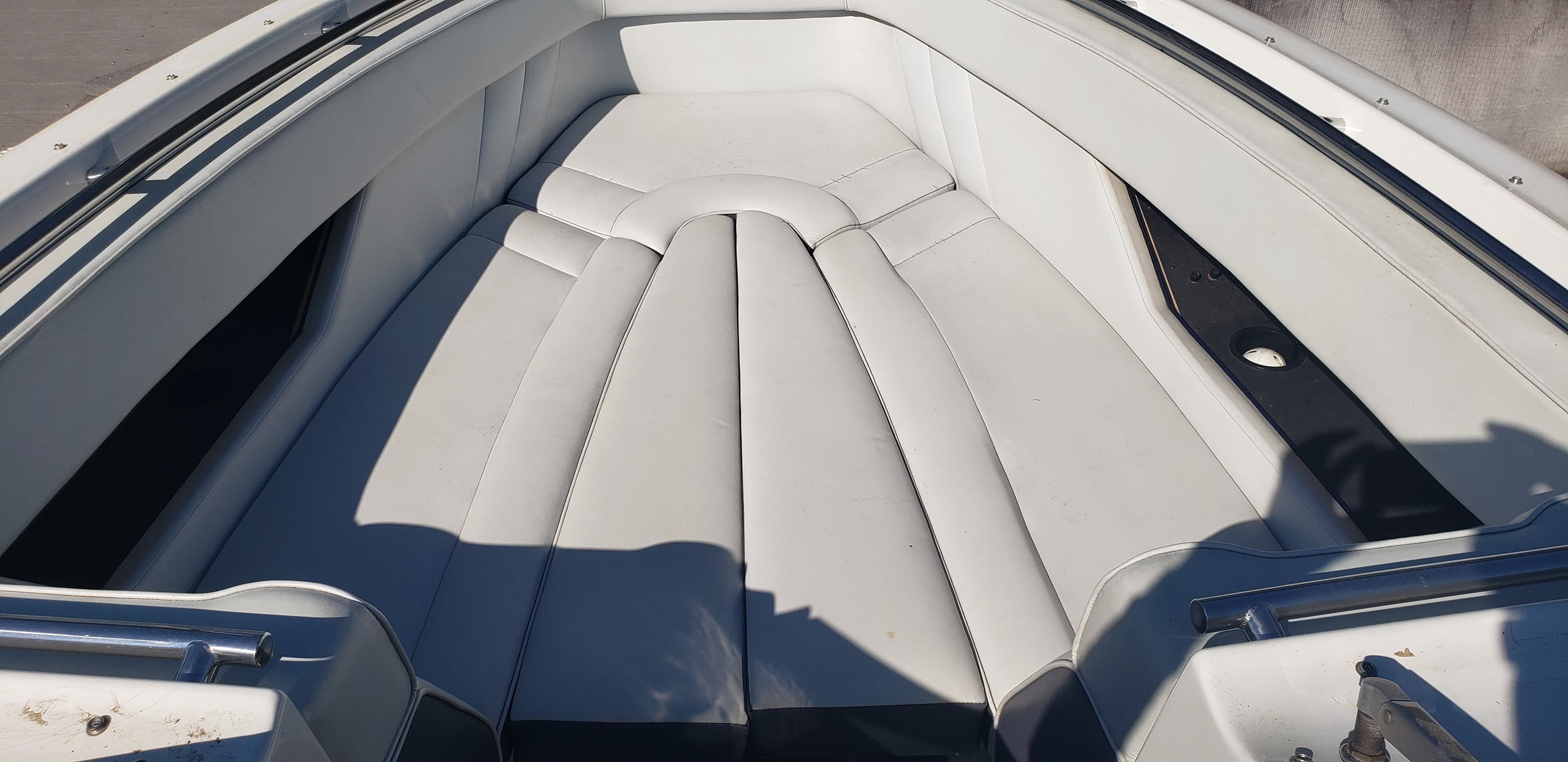 Interior of a 1993 Cobalt 272 boat with white upholstery.