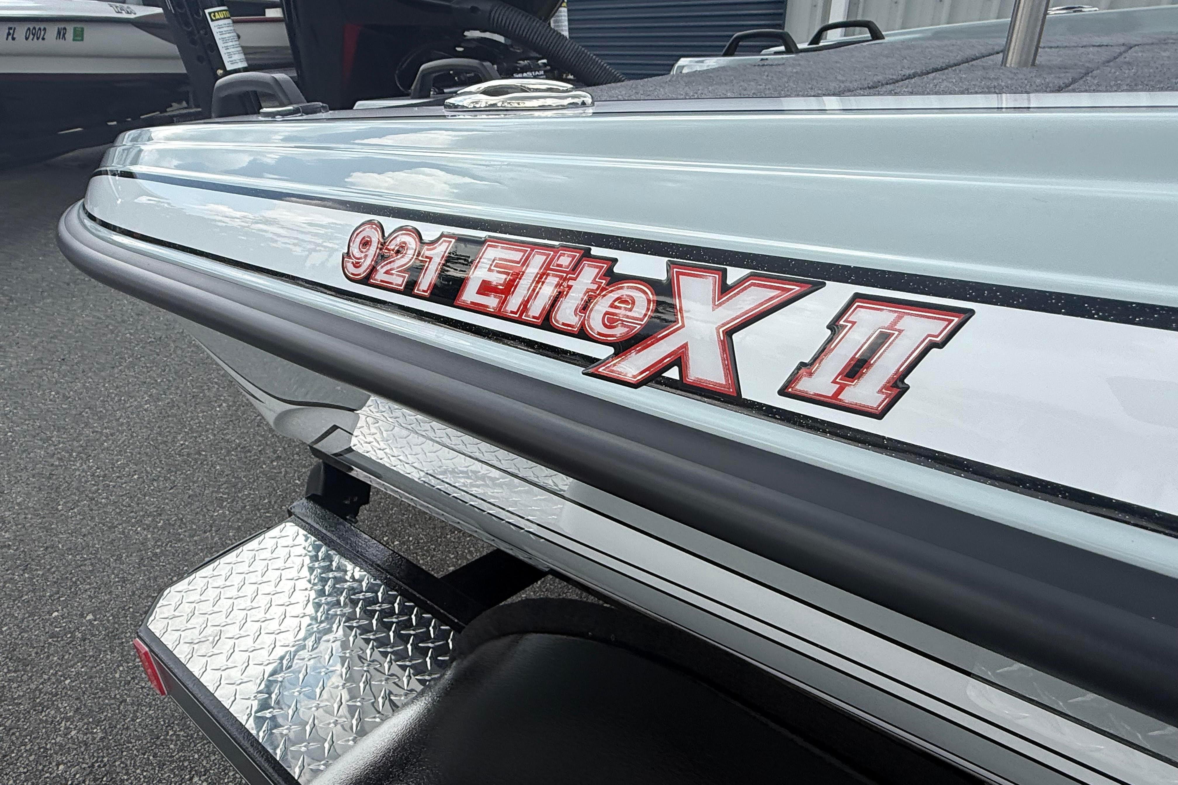 2027 Phoenix 921 Elite X II boat, close-up of model name on hull.