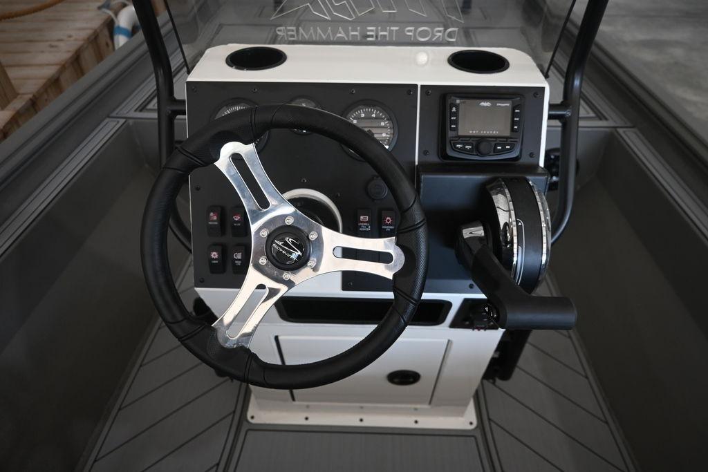 2026 Thor Lake Hammer 1900CC boat dashboard with steering wheel and controls.