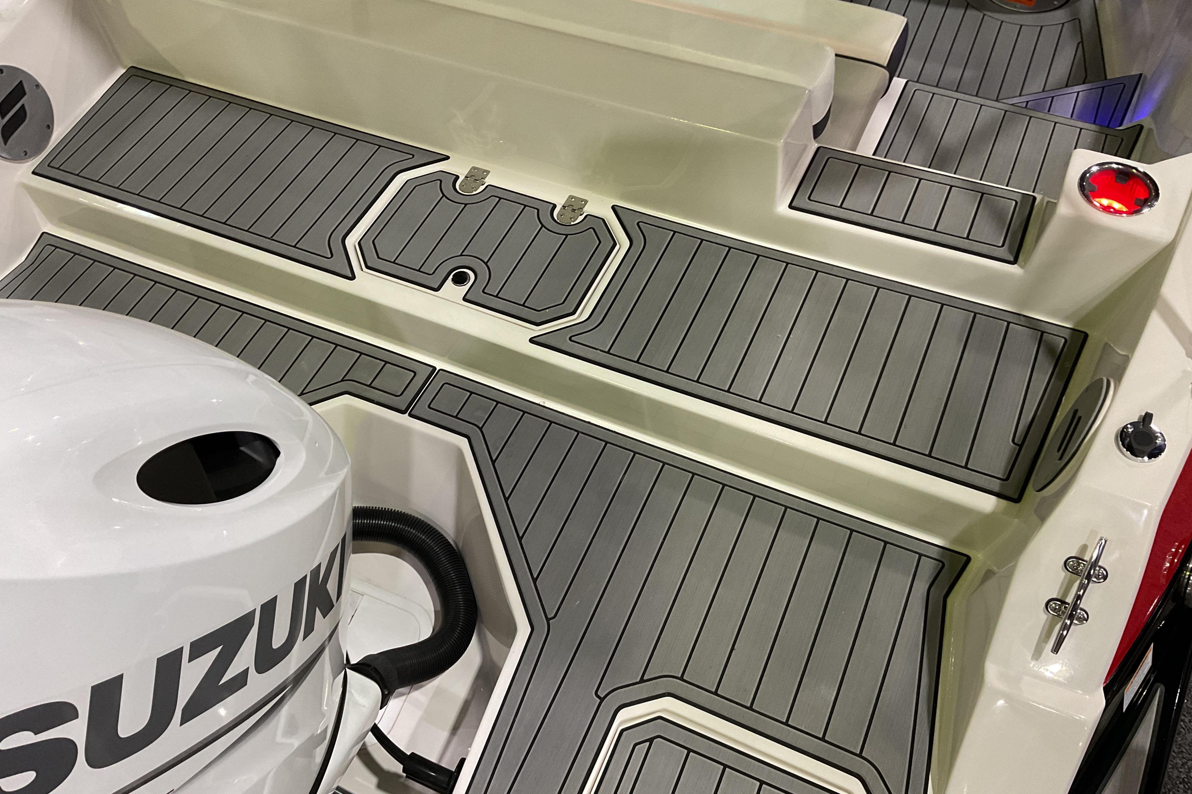2026 Starcraft SVX 210 DC OB boat deck with Suzuki outboard motor.