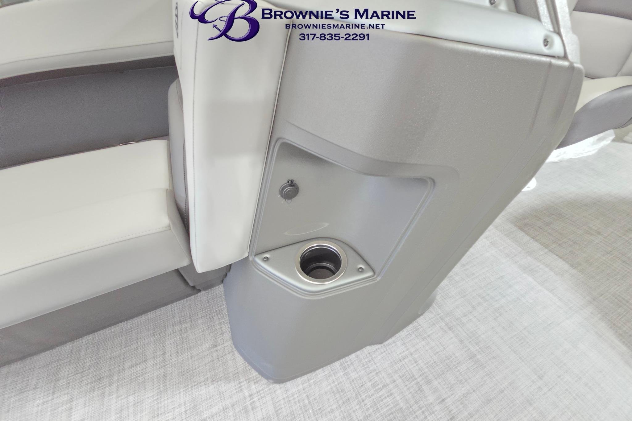 2026 Sun Tracker Party Barge 18 DLX interior with cup holder and seating detail.