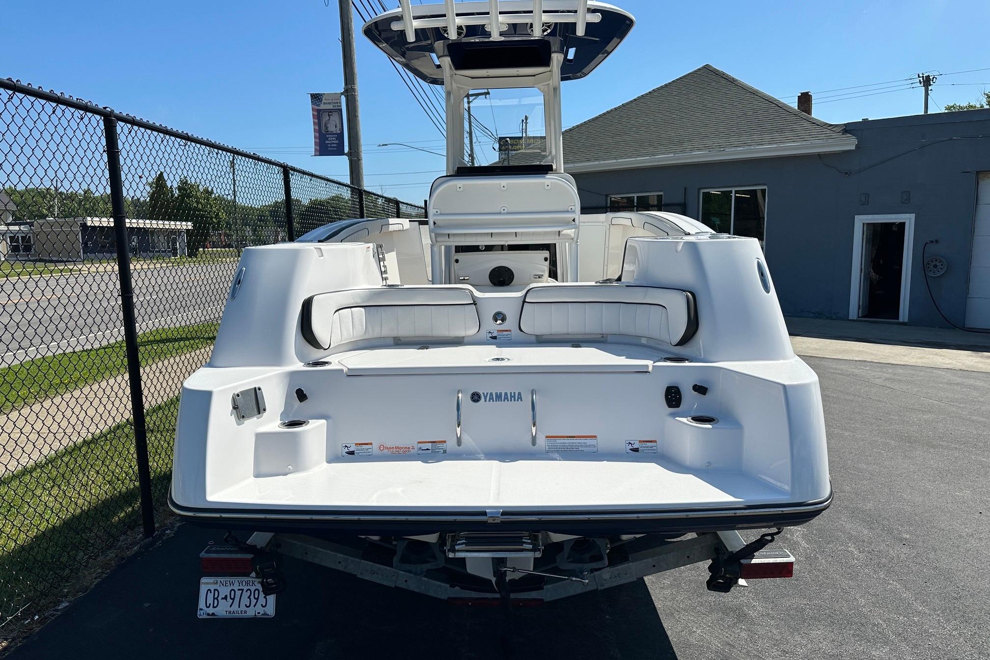 2022 Yamaha Boats 255 FSH Sport E, rear view, parked on trailer.