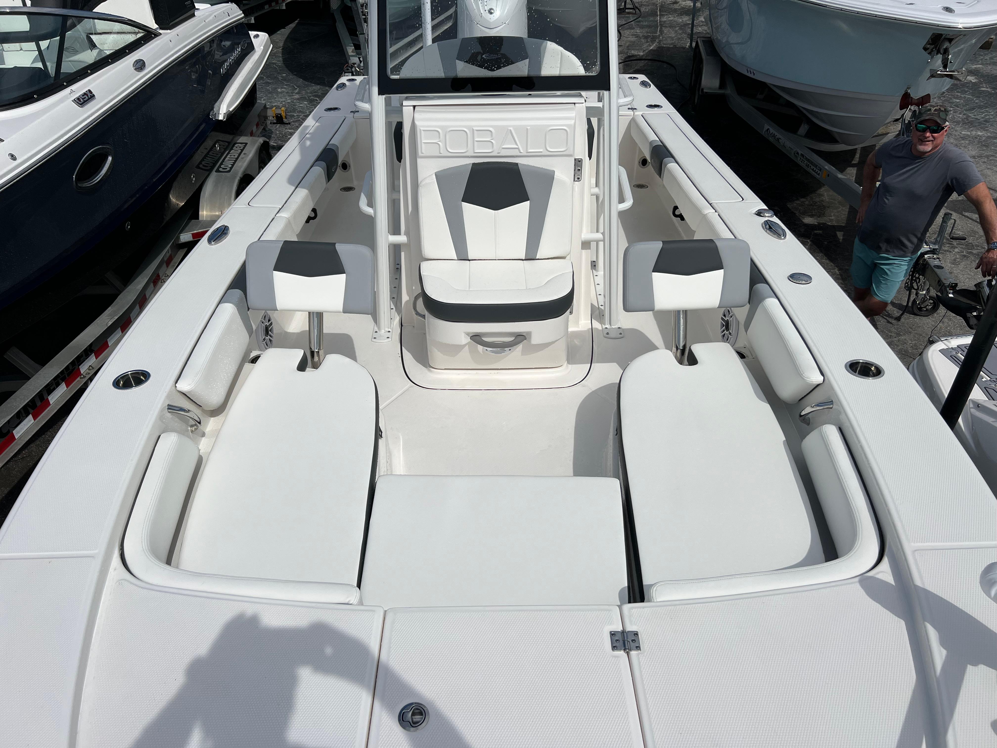 2024 Robalo 246 Sky Deck boat interior with seating and console.