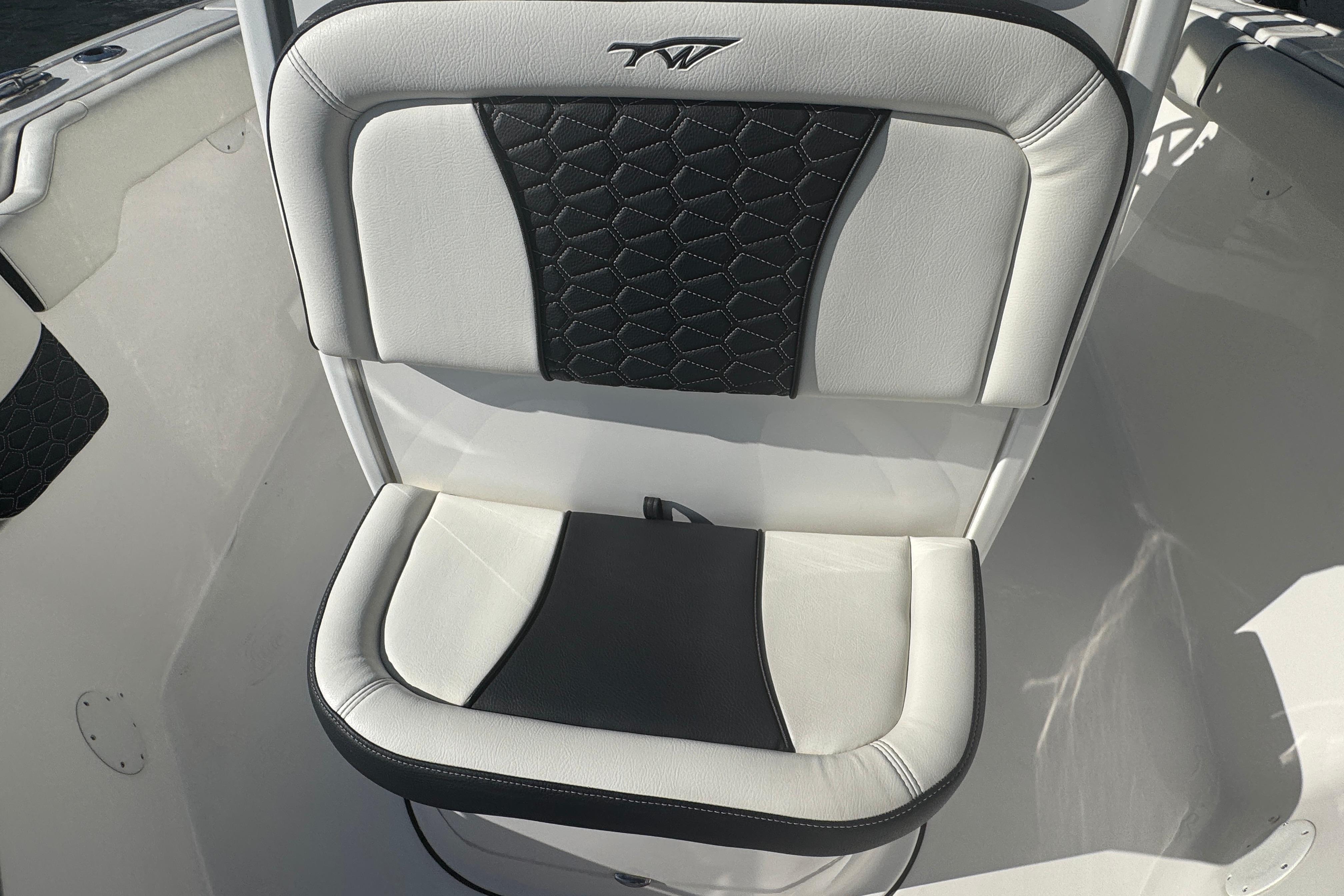2025 Tidewater 232 LXF boat seat with black and white upholstery design.