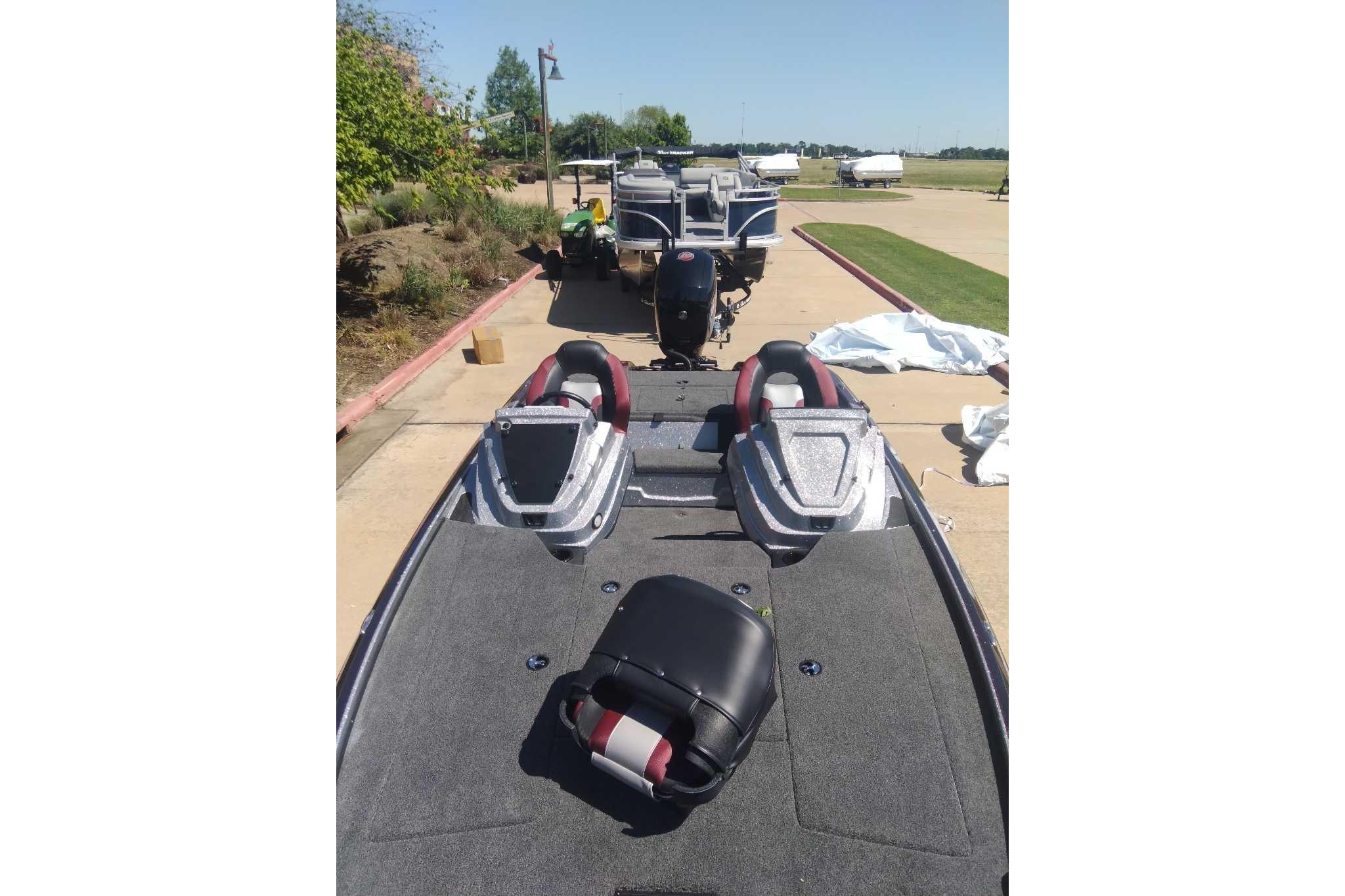 2026 Nitro Z18 boat on trailer, parked outdoors on a sunny day.